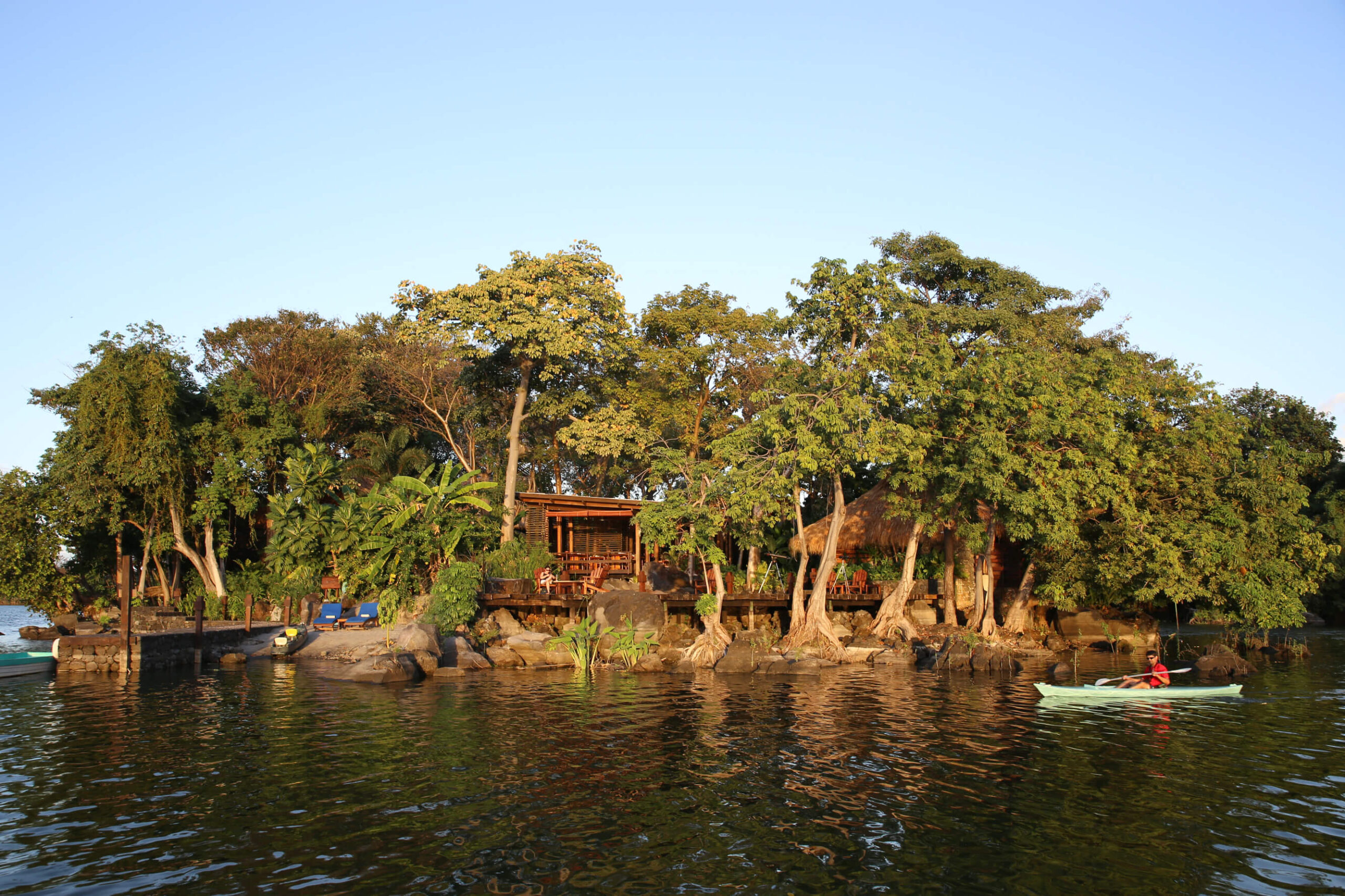 Exterior of the island lodge among trees on the lake, Jicaro Island Ecolodge, Lake Nicaragua, Granada, Nicaragua