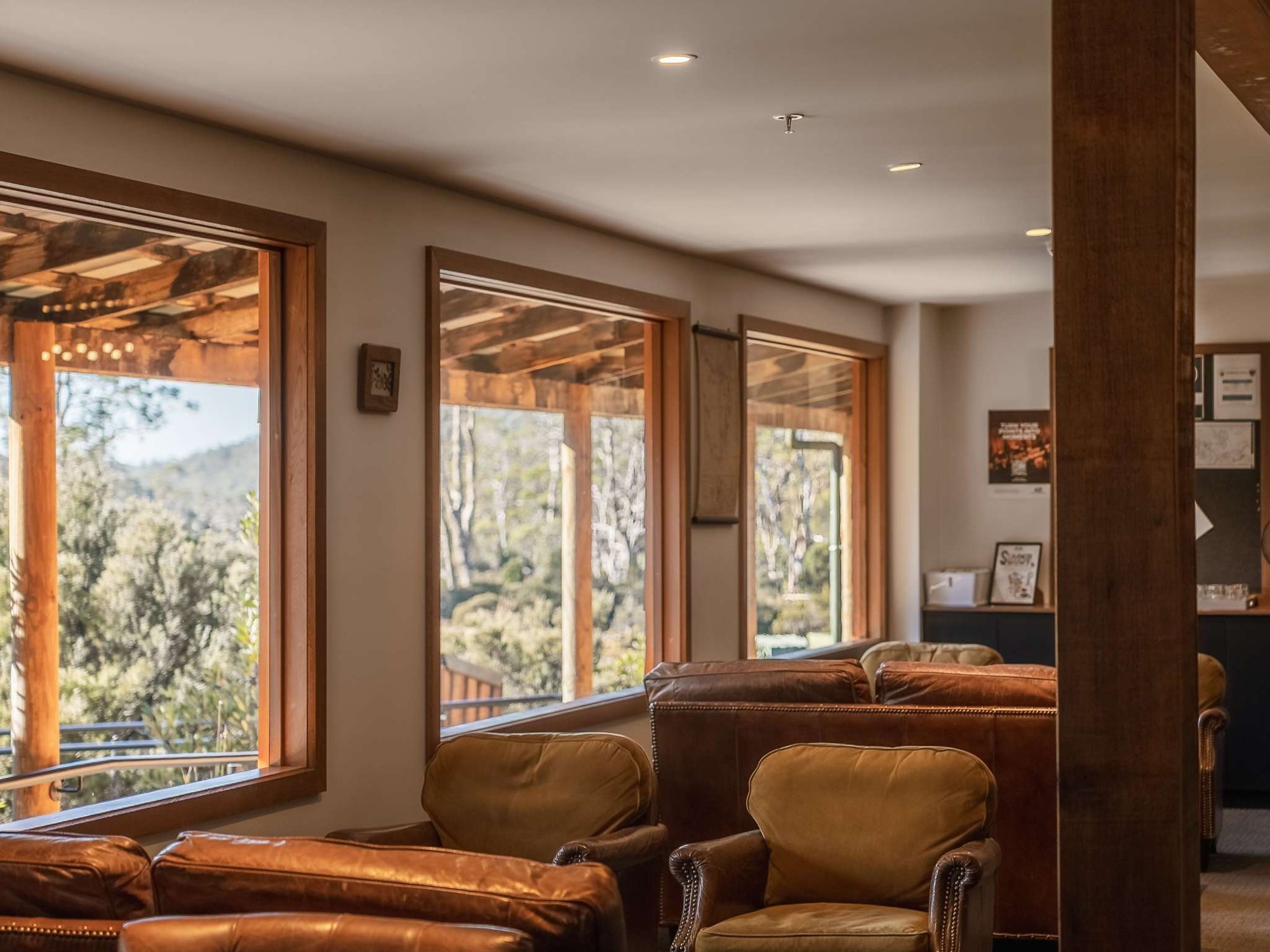 Window-side lounge overlooking the grounds at Peppers Cradle Mountain Lodge