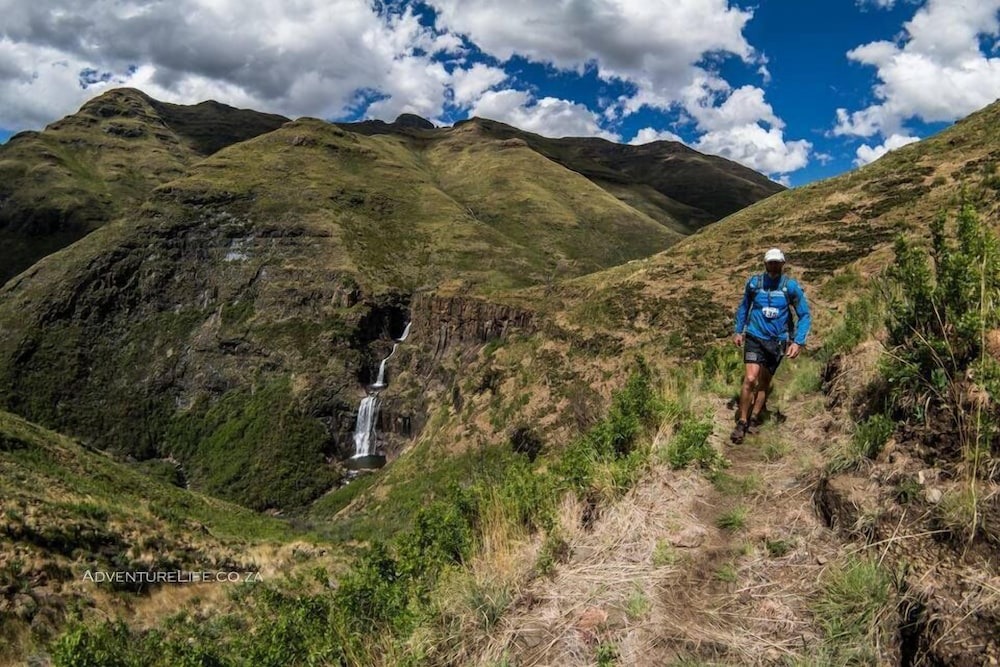 Hiking trail beside a waterfall in the mountains, Maliba Mountain Lodge, Ts’ehlanyane National Park, Lesotho