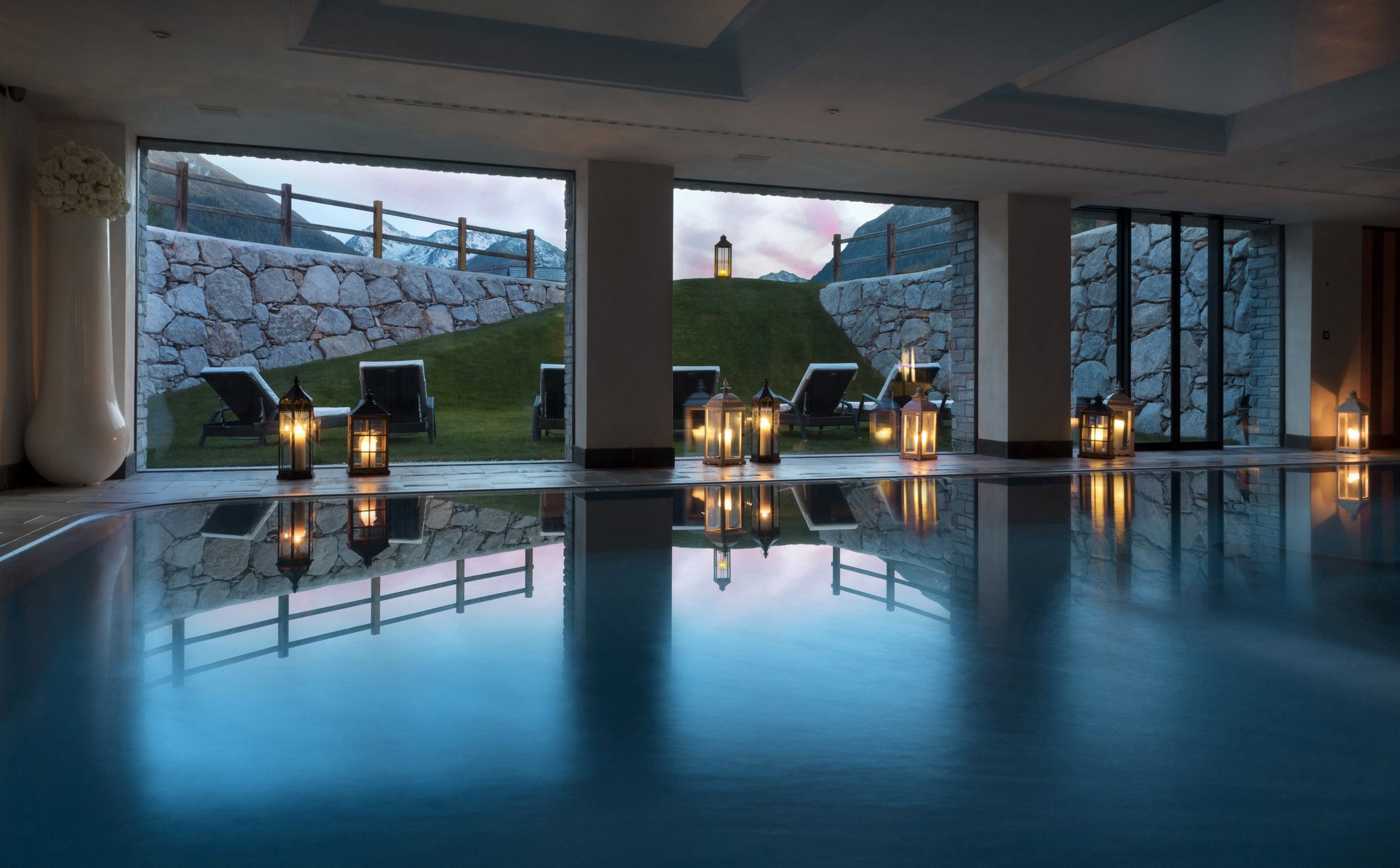Indoor swimming pool at dusk, Lac Salin Spa & Mountain Resort, Livigno, Italy