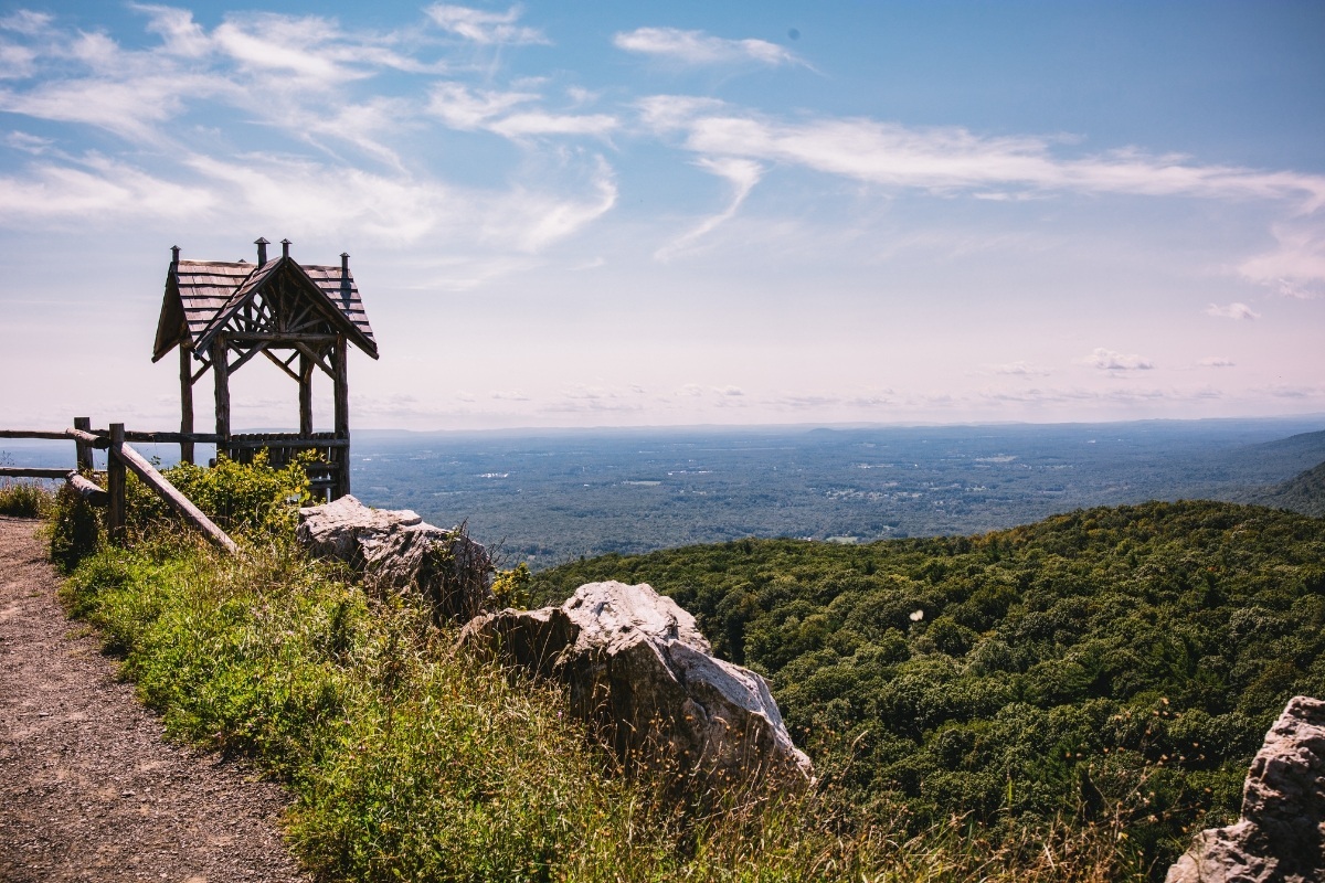 Clifftop wooden gazebo overlooking forested hills at Mohonk Mountain House, New Paltz, USA