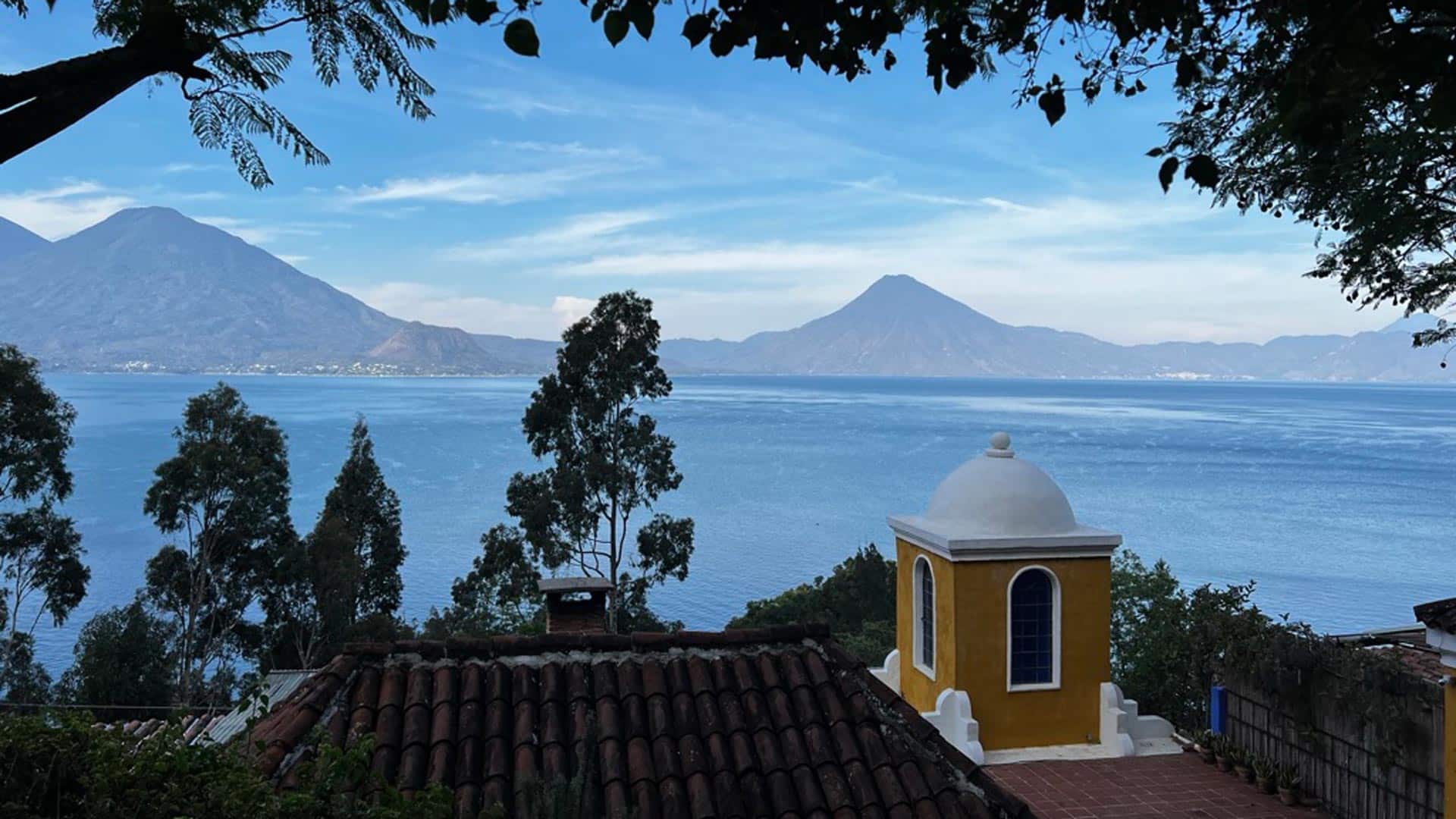 Lake and volcano view above the hotel rooftops, Casa Palopó, Lake Atitlán, Guatemala