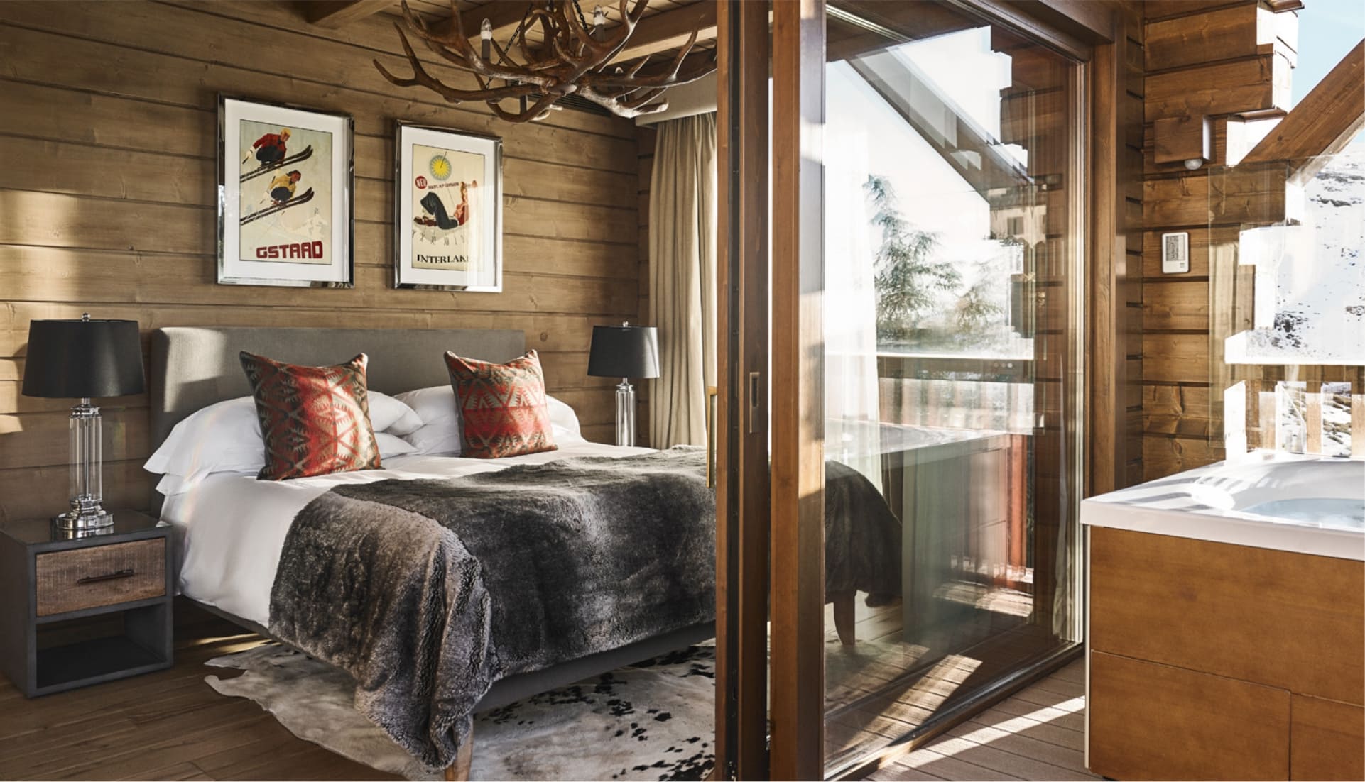 Bedroom opening onto a timber terrace at El Lodge, Sierra Nevada, Spain