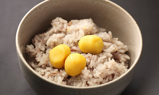 Bowl of rice topped with yellow chestnuts at Takaragawa Onsen Osenkaku, Gunma, Japan