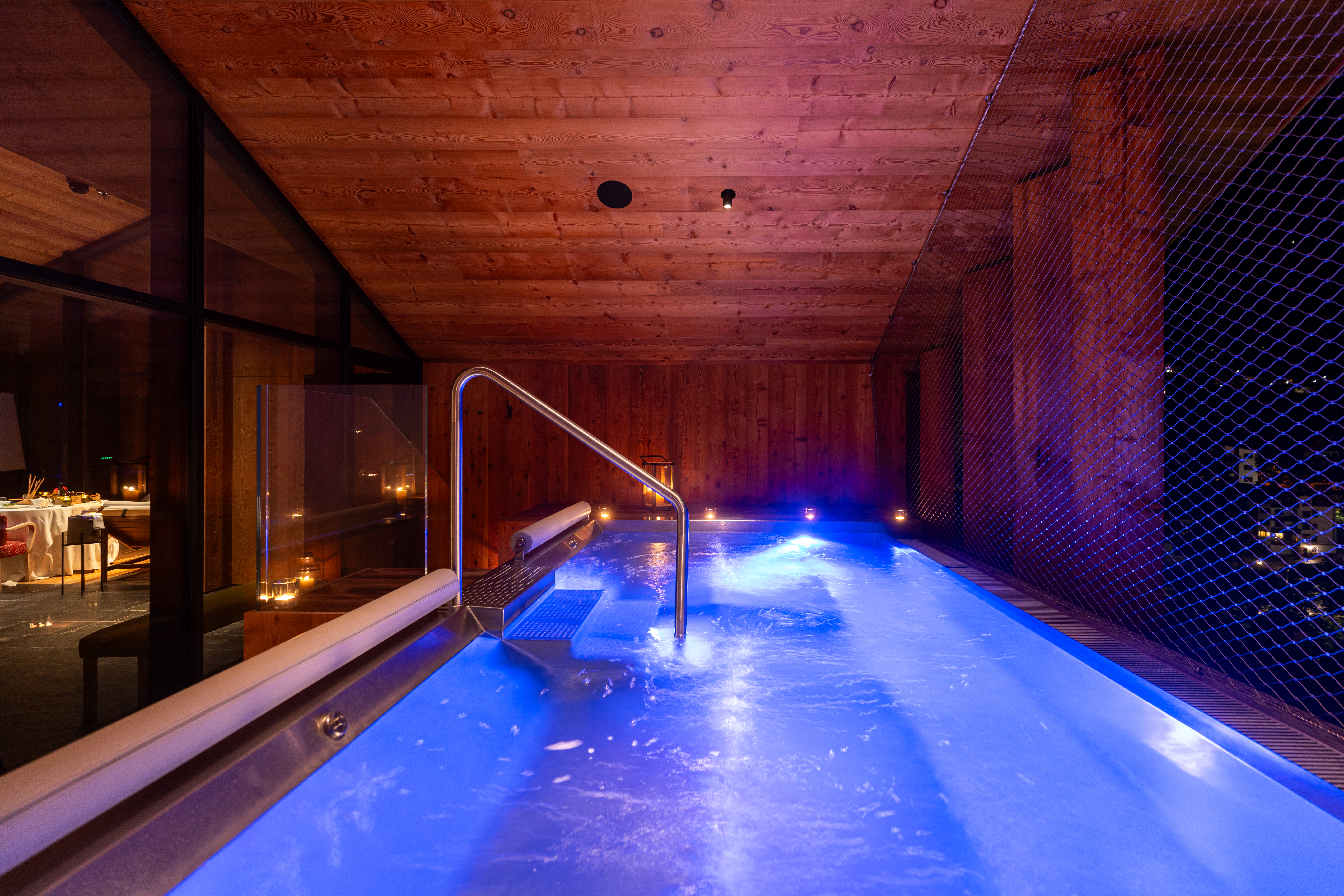 Illuminated indoor spa hydrotherapy pool, Hotel de Lën, Cortina d’Ampezzo, Italy