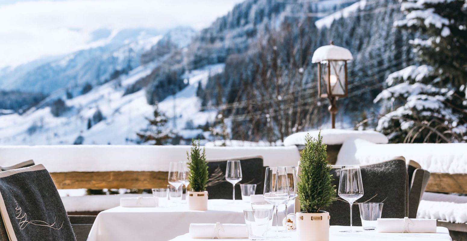 Winter terrace overlooking snow-covered mountains, Hotel Tannenhof, St. Anton am Arlberg, Austria