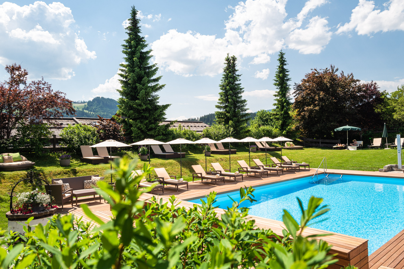Outdoor pool and garden loungers, Tennerhof, Kitzbühel, Austria