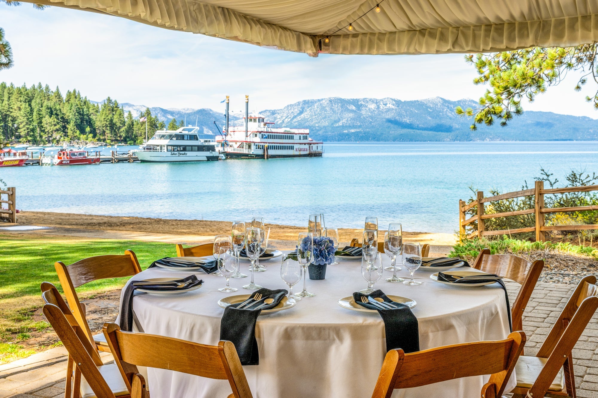 Dining table overlooking the lake and paddlewheel boat at Zephyr Cove Resort, Zephyr Cove, USA