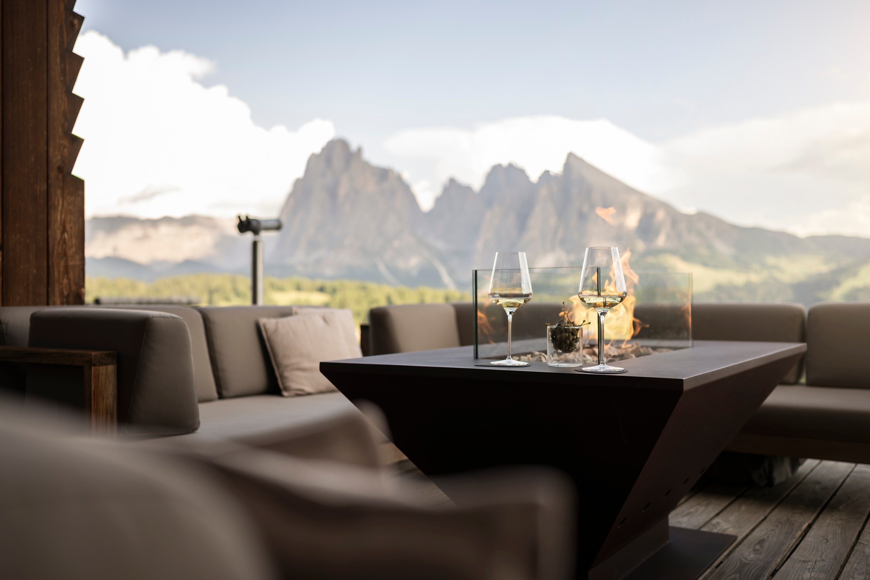 Restaurant seating overlooking the Dolomites at Adler Mountain Lodge, Alpe di Siusi (Seiser Alm), Italy