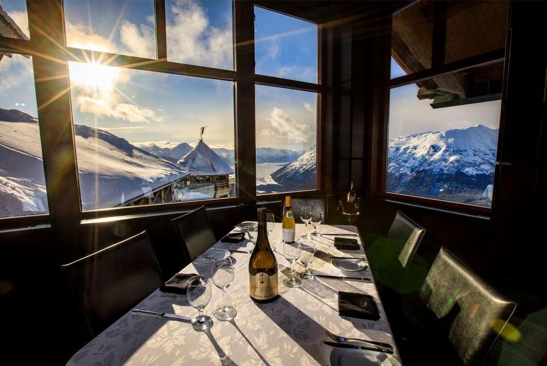 Seven Glaciers restaurant dining room with panoramic mountain views, Alyeska Resort, Alaska, USA