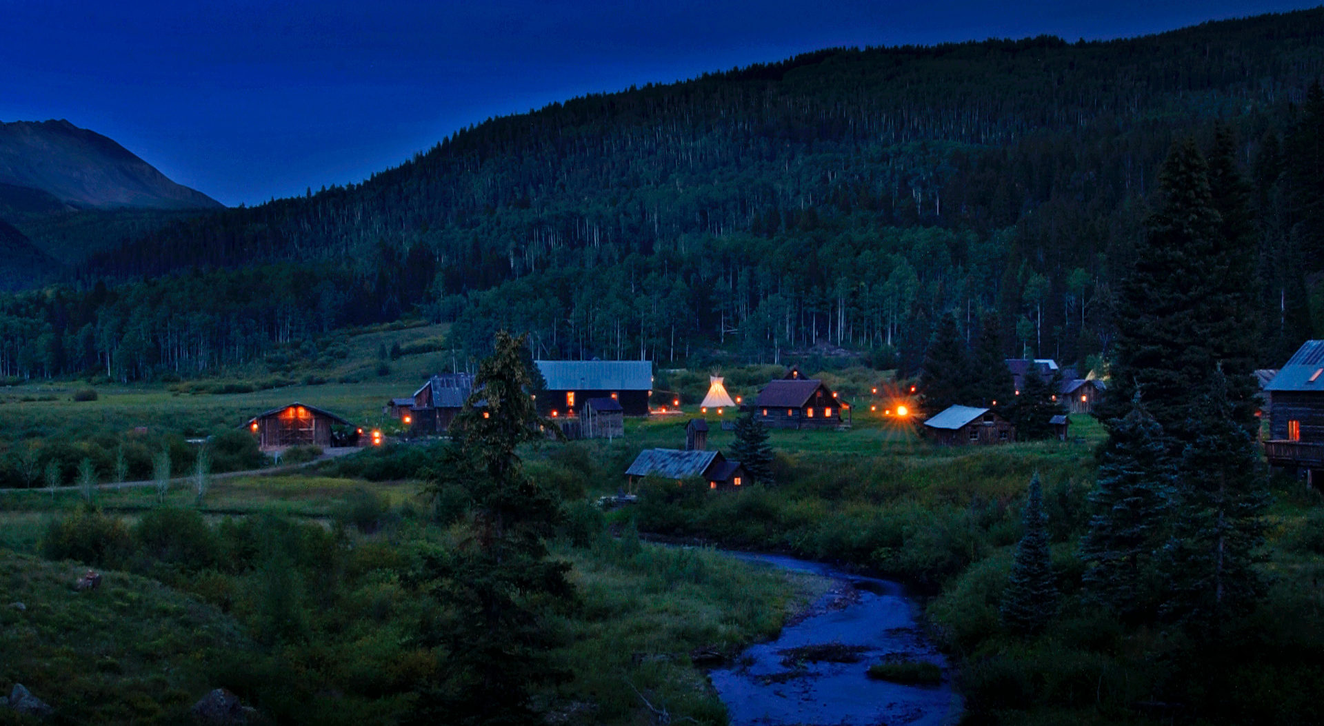 Elevated view of Dunton Hot Springs village in its alpine valley.