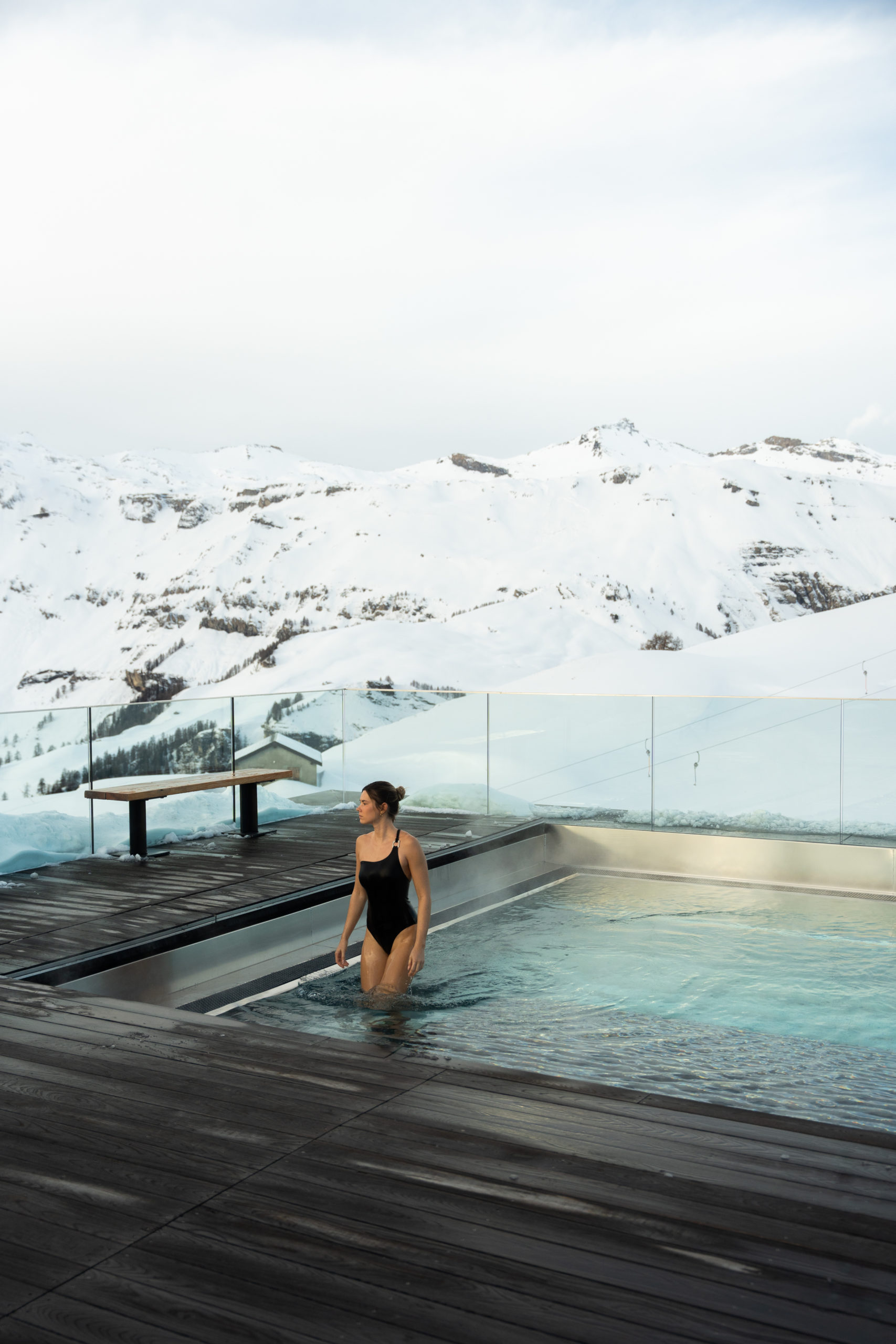 Heated outdoor pool overlooking snowy mountains, Chetzeron, Crans-Montana, Switzerland