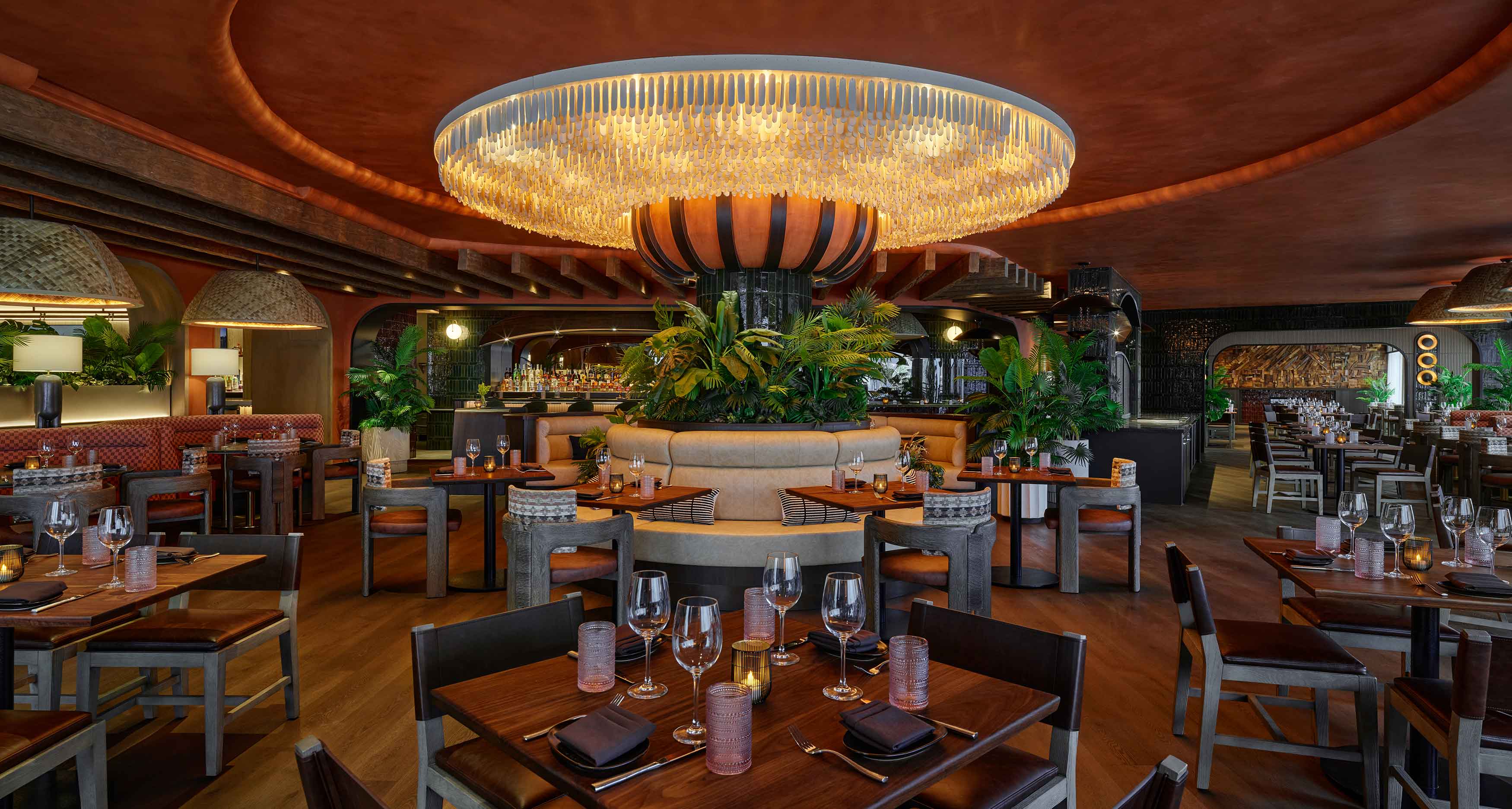 Toro dining room at Viceroy Snowmass, with circular lighting, wood tables and warm mountain interiors.