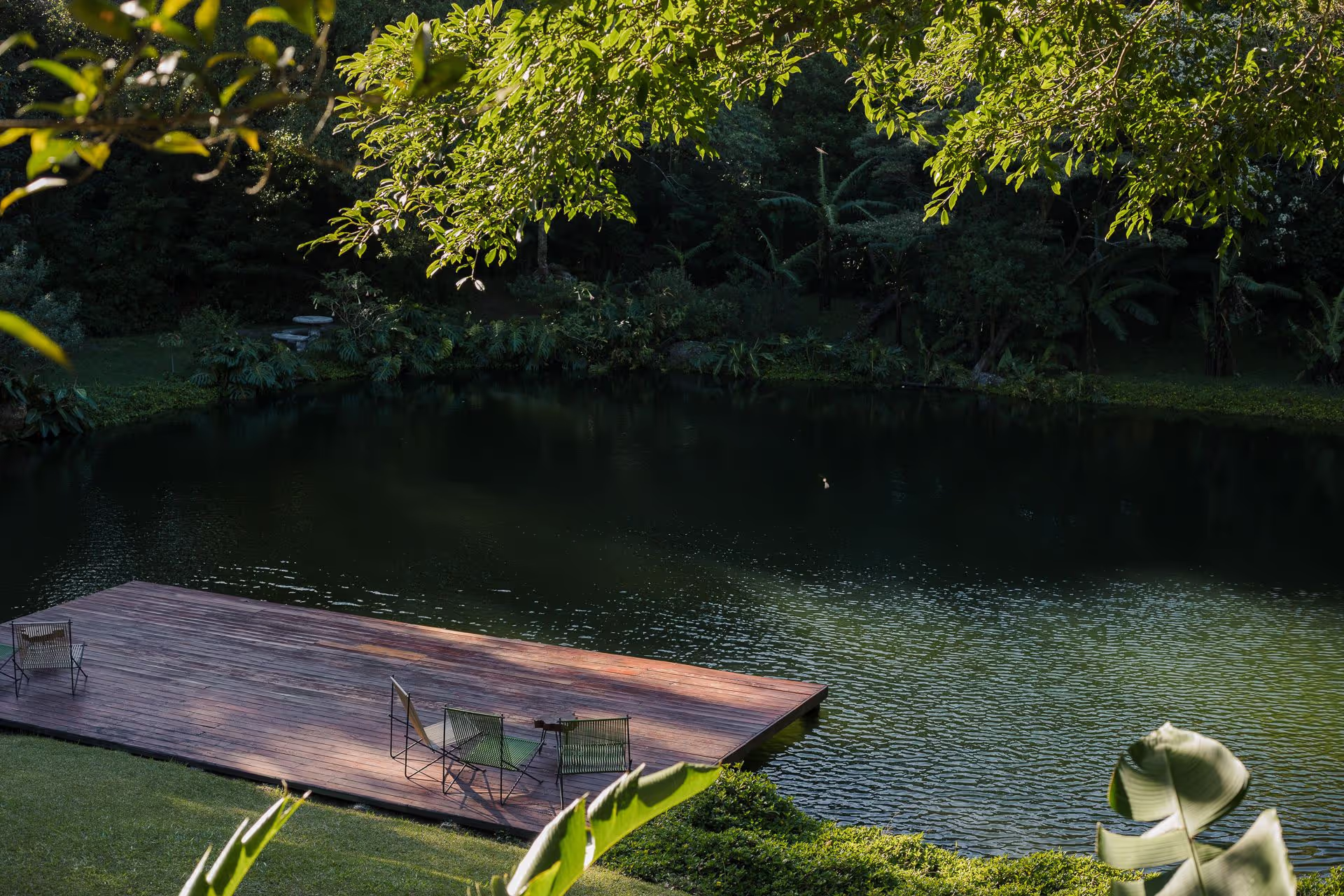 Spring-water pond with a wooden waterside platform, Hotel Belmar, Monteverde, Costa Rica