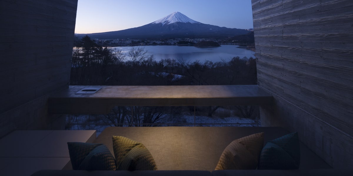 Terrace seating overlooking Lake Kawaguchi and Mount Fuji at dusk