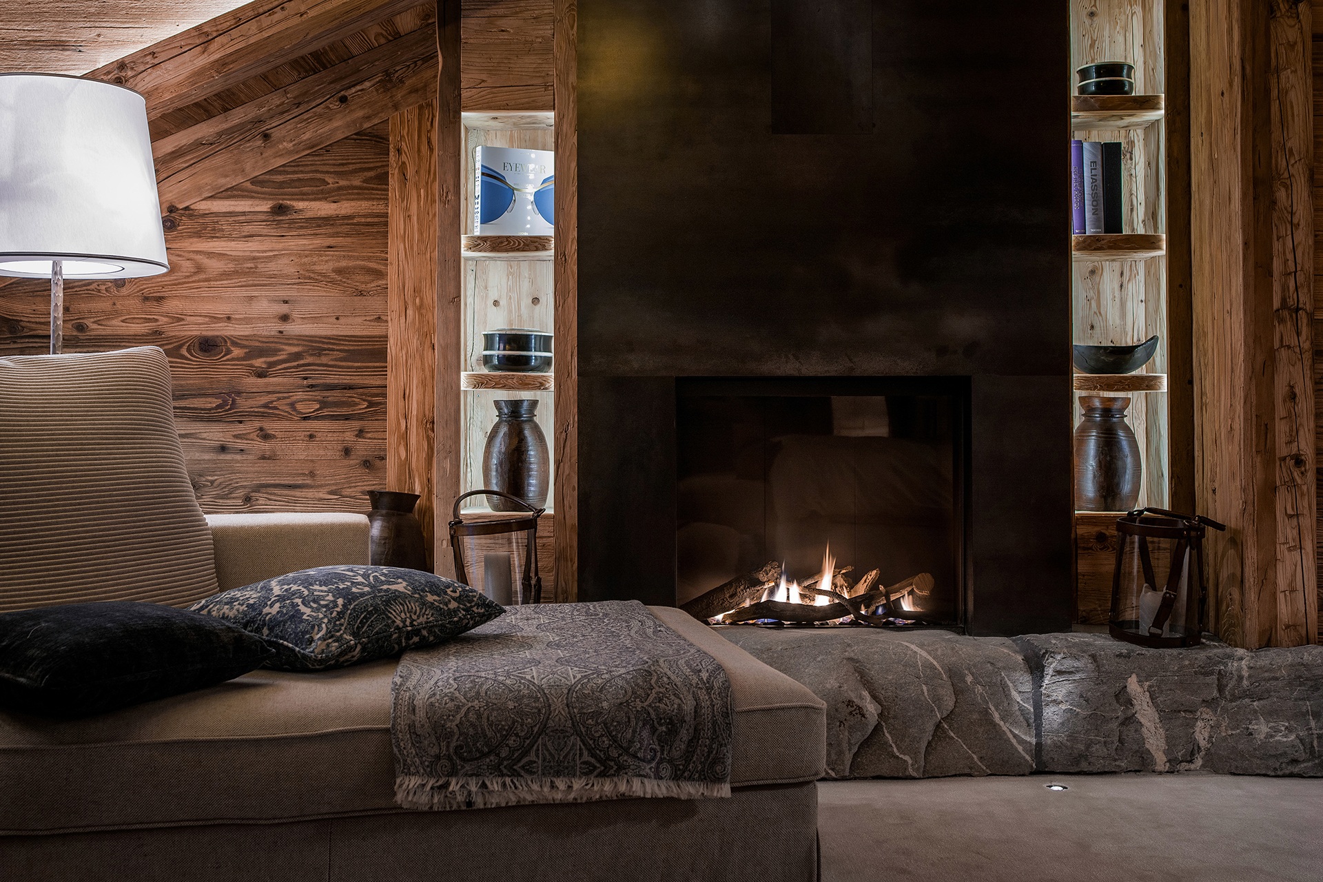 Suite lounge with fireplace at The Alpina Gstaad, Gstaad, Switzerland