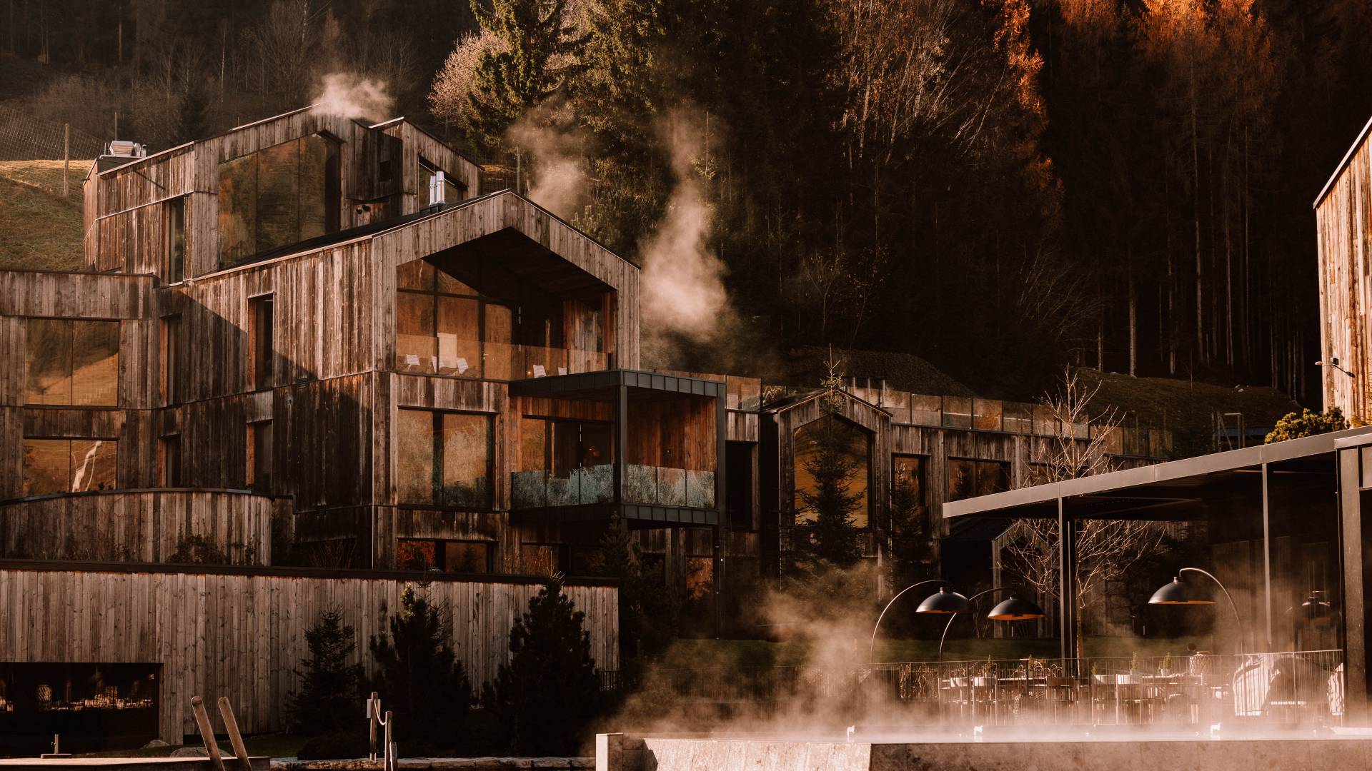 Outdoor setting in autumn with colourful forest at Naturhotel Forsthofgut, Leogang, Austria