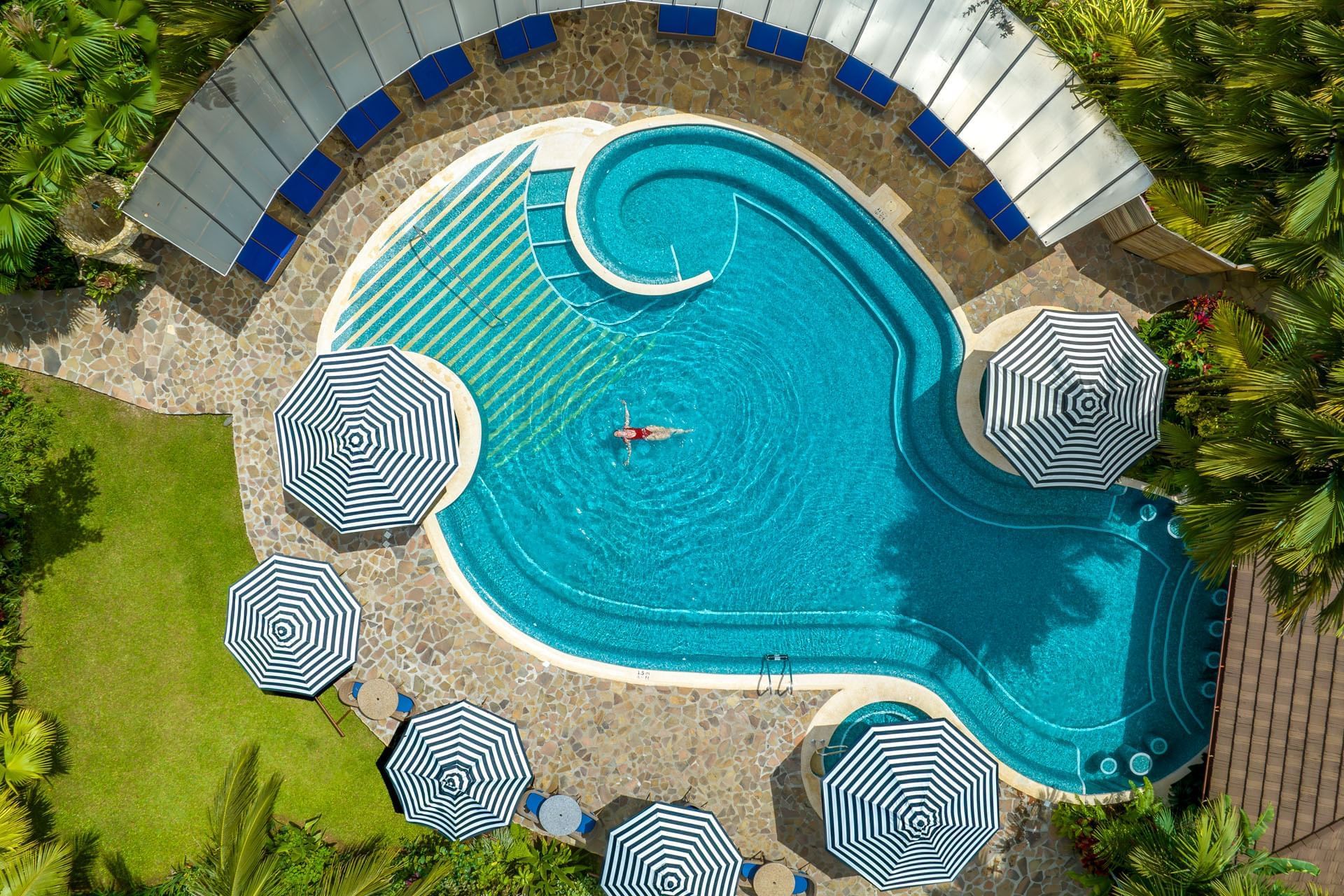 Overhead view of the swimming pool and umbrella-shaded decks, Hideaway Rio Celeste, Tenorio, Costa Rica