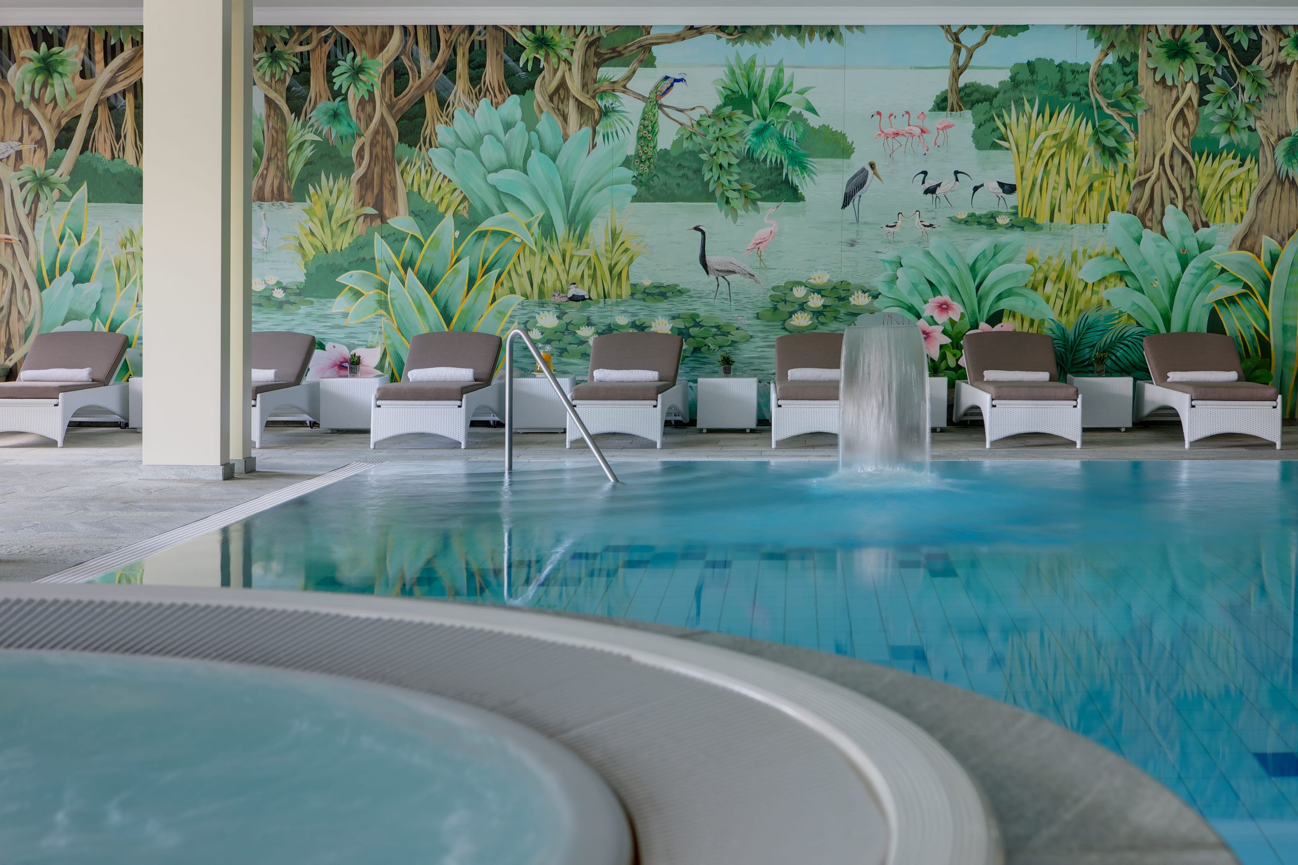 Indoor pool with curved steps and mural, Steigenberger Icon Grandhotel Belvédère, Davos, Switzerland
