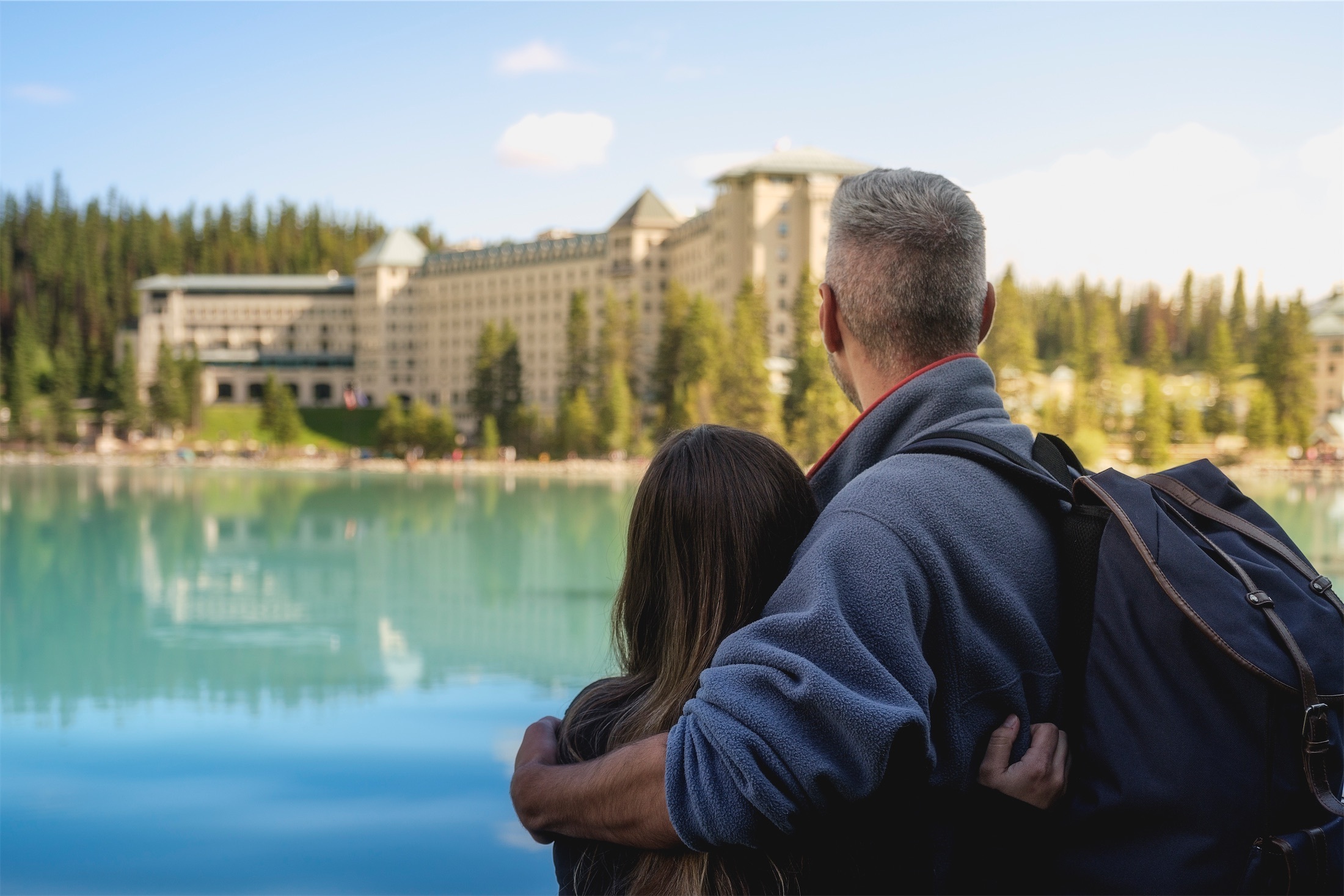 Guests looking across the lake toward the hotel exterior, Lake Louise, Canada