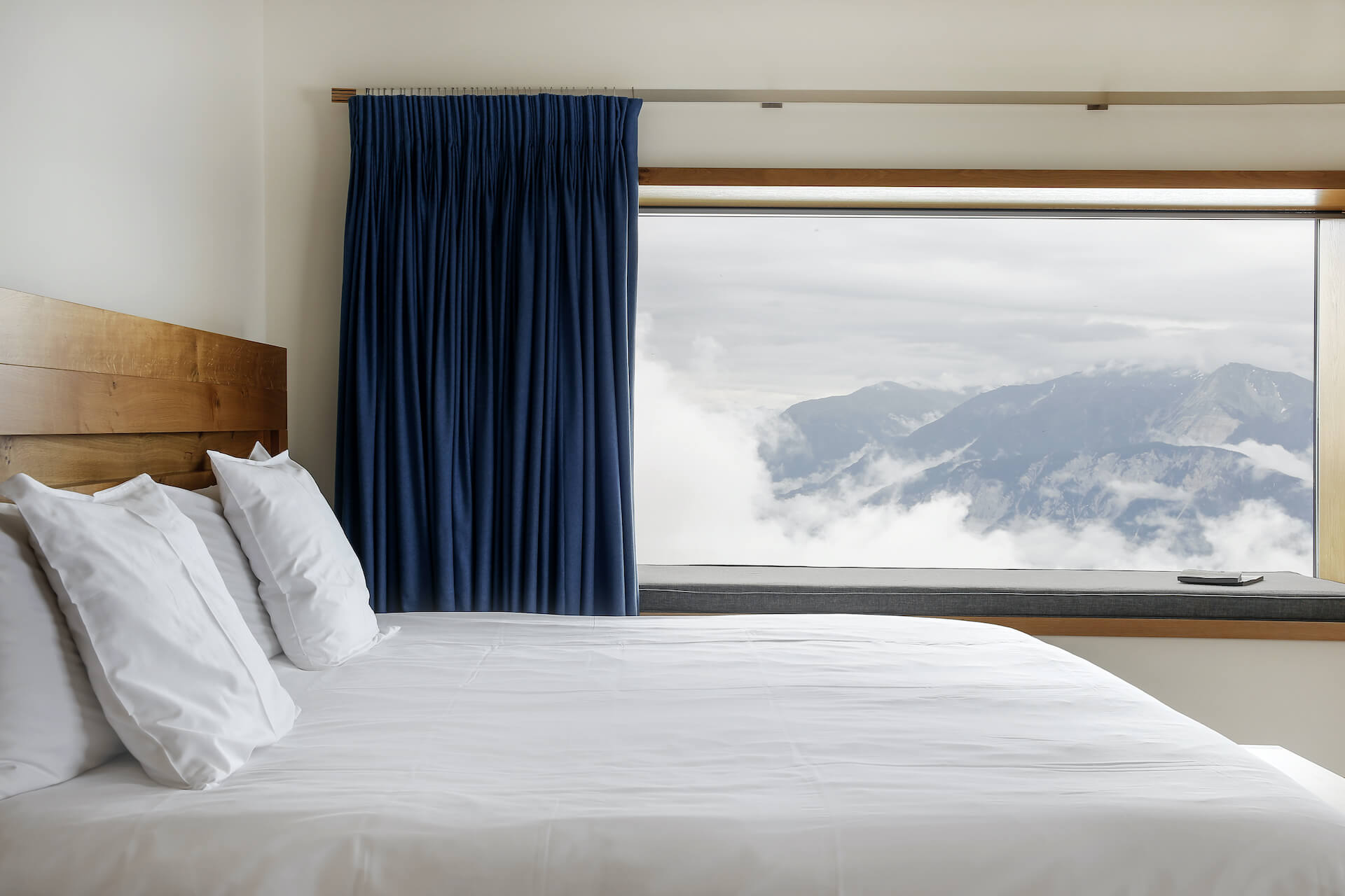 Guest room with large picture window framing the Alps, Chetzeron, Crans-Montana, Switzerland