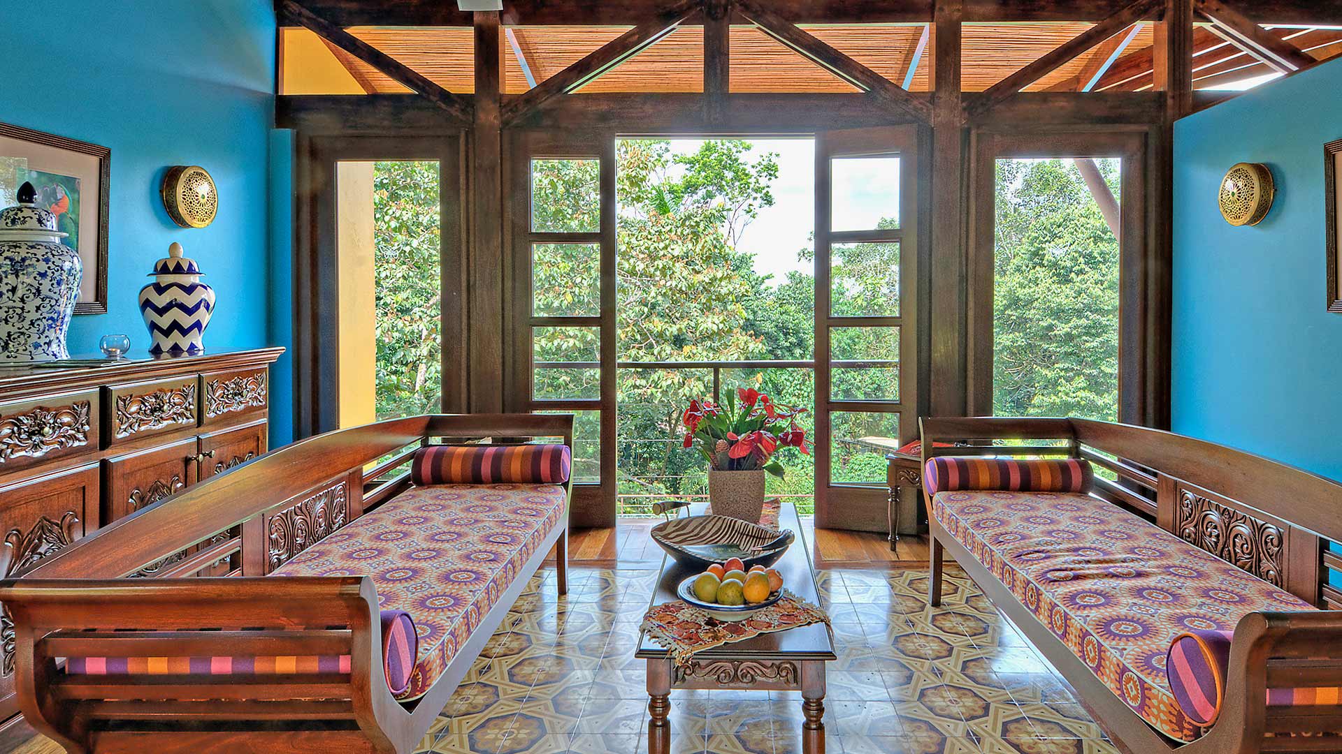 Colorful cushioned lounge with large forest-facing windows, Nayara Tented Camp, Arenal, Costa Rica
