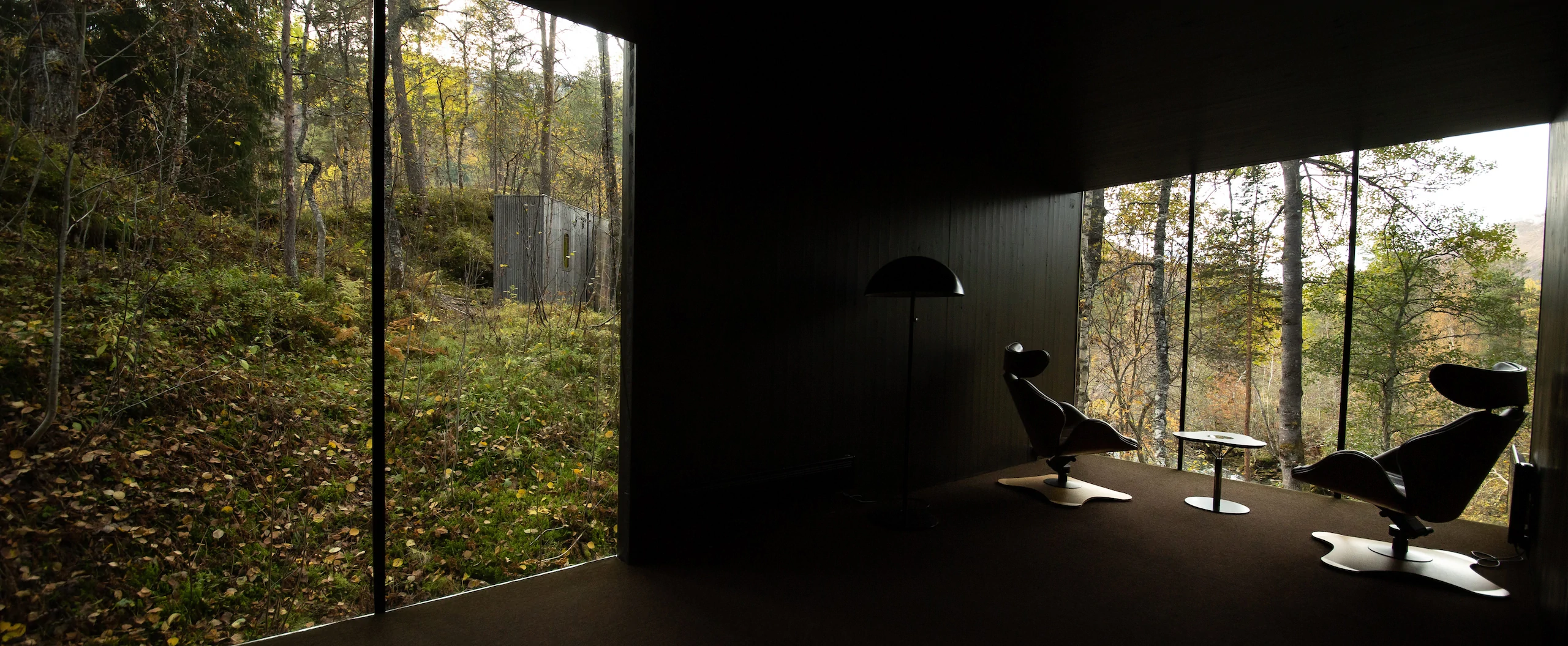 Interior of a glass-walled Landscape Room at Juvet Landscape Hotel, Valldal, Norway