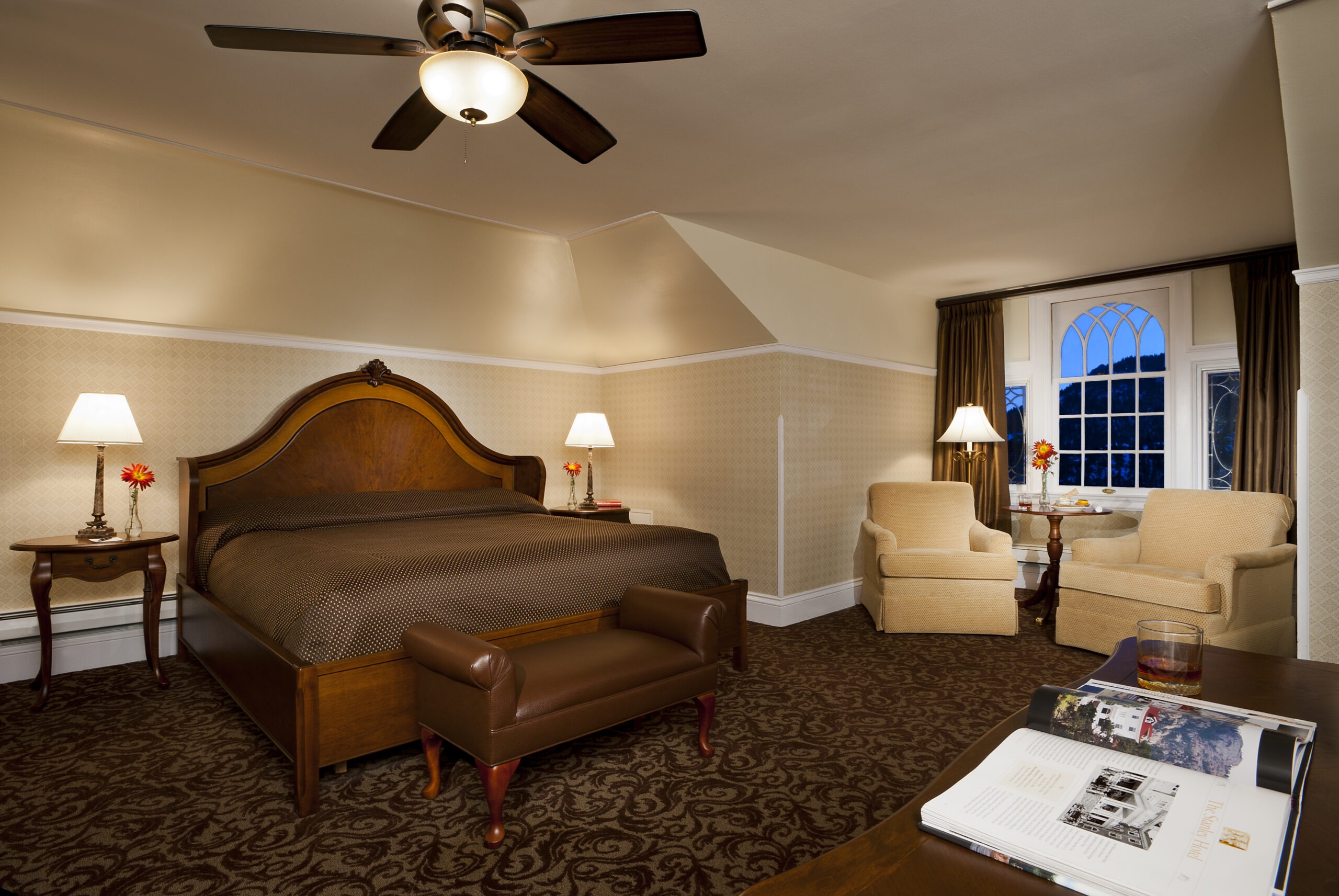 Deluxe King guest room with mountain-view window at The Stanley Hotel, Estes Park, USA