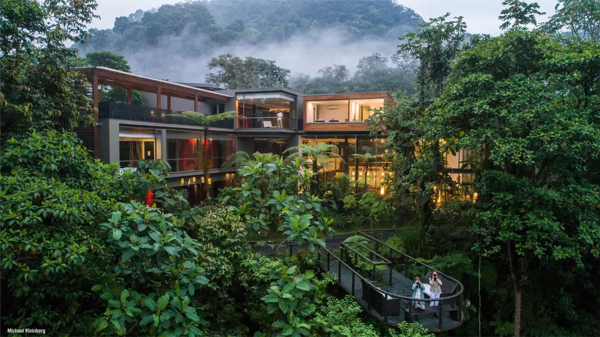 Modern lodge buildings nestled in dense tropical forest at Mashpi Lodge, Ecuador