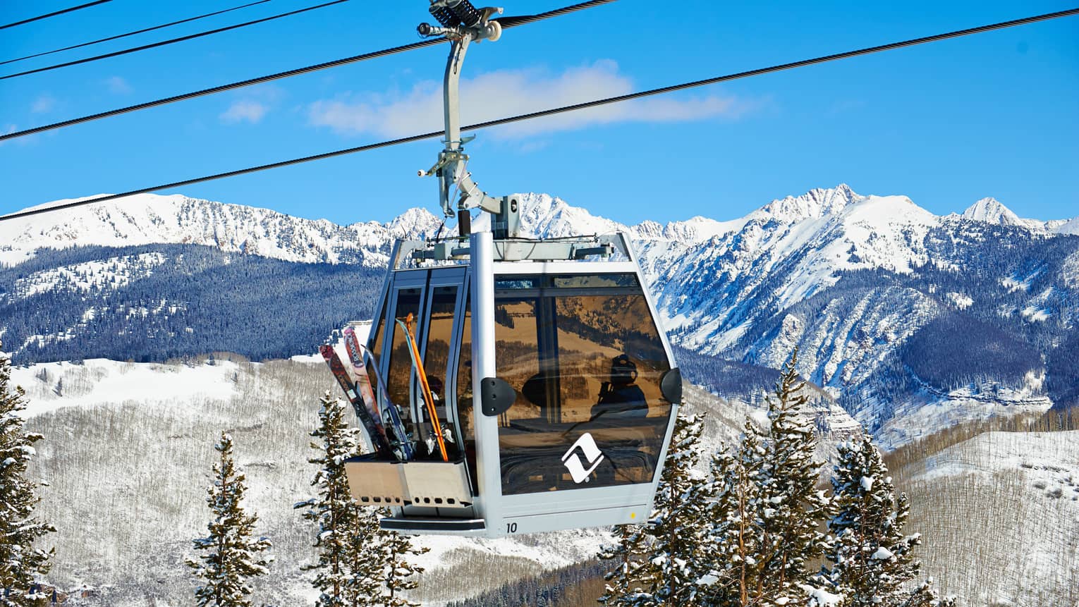 Gondola above the snowy slopes of Vail Mountain