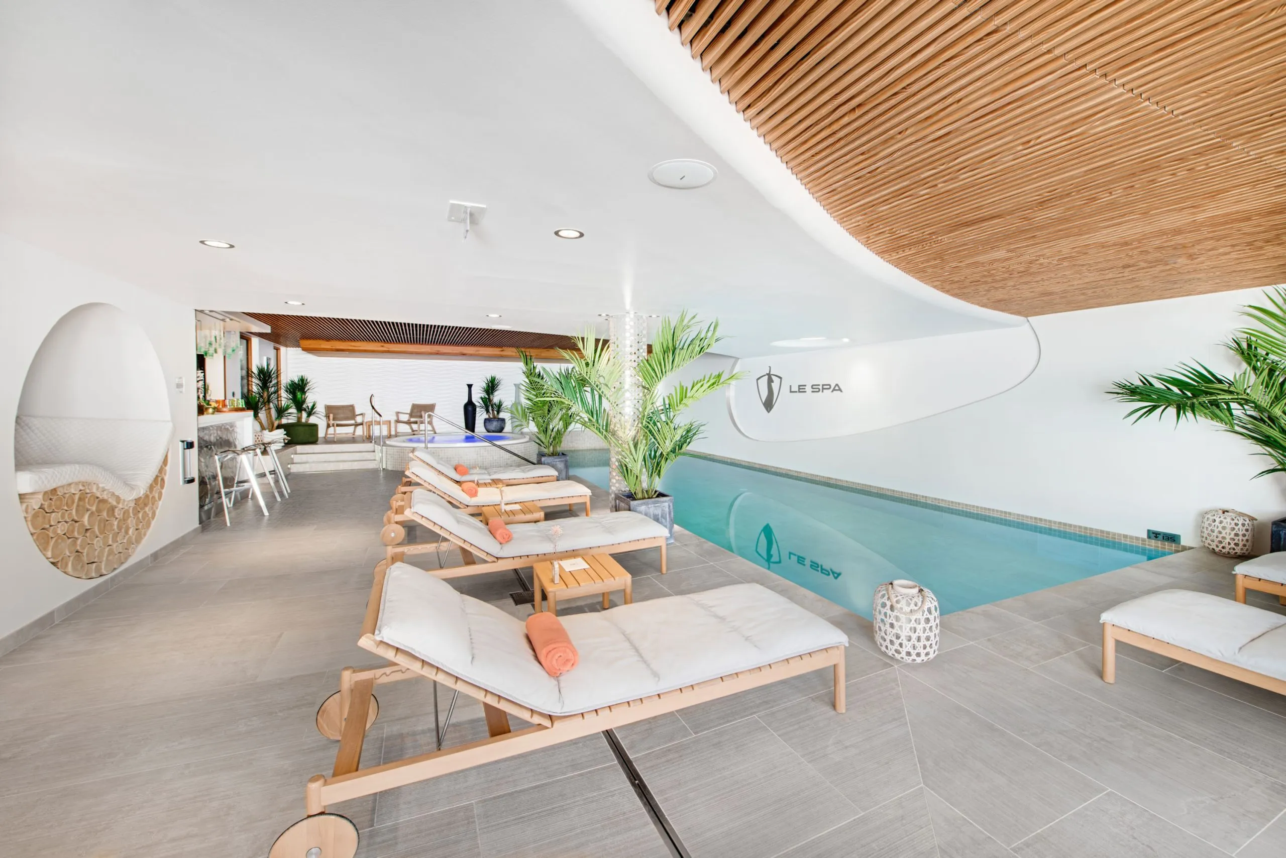 Poolside loungers and indoor swimming pool, Hotel Pashmina Le Refuge, Val Thorens, France
