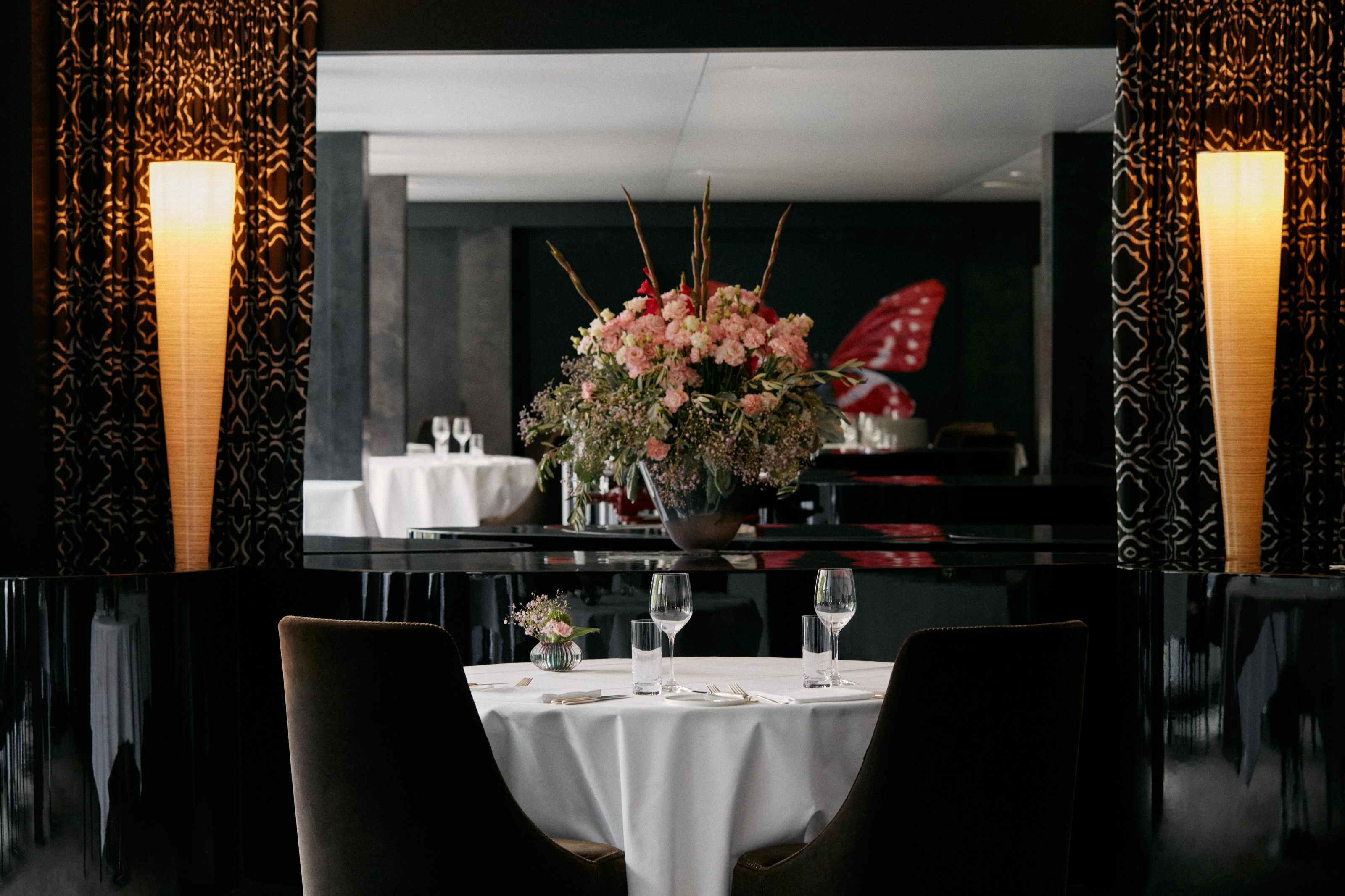 White-clothed tables and flowers at 7132 Red, Vals, Switzerland