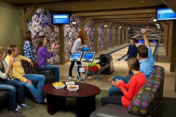 Guests bowling in the rustic, mine-themed bowling alley at One Ski Hill Place.