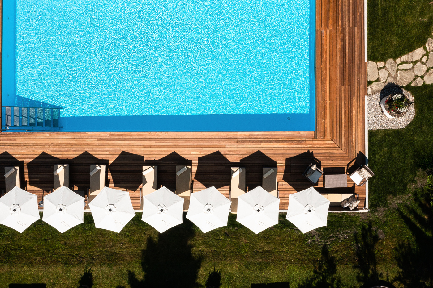 Aerial view of outdoor pool and sun terrace, Tennerhof, Kitzbühel, Austria