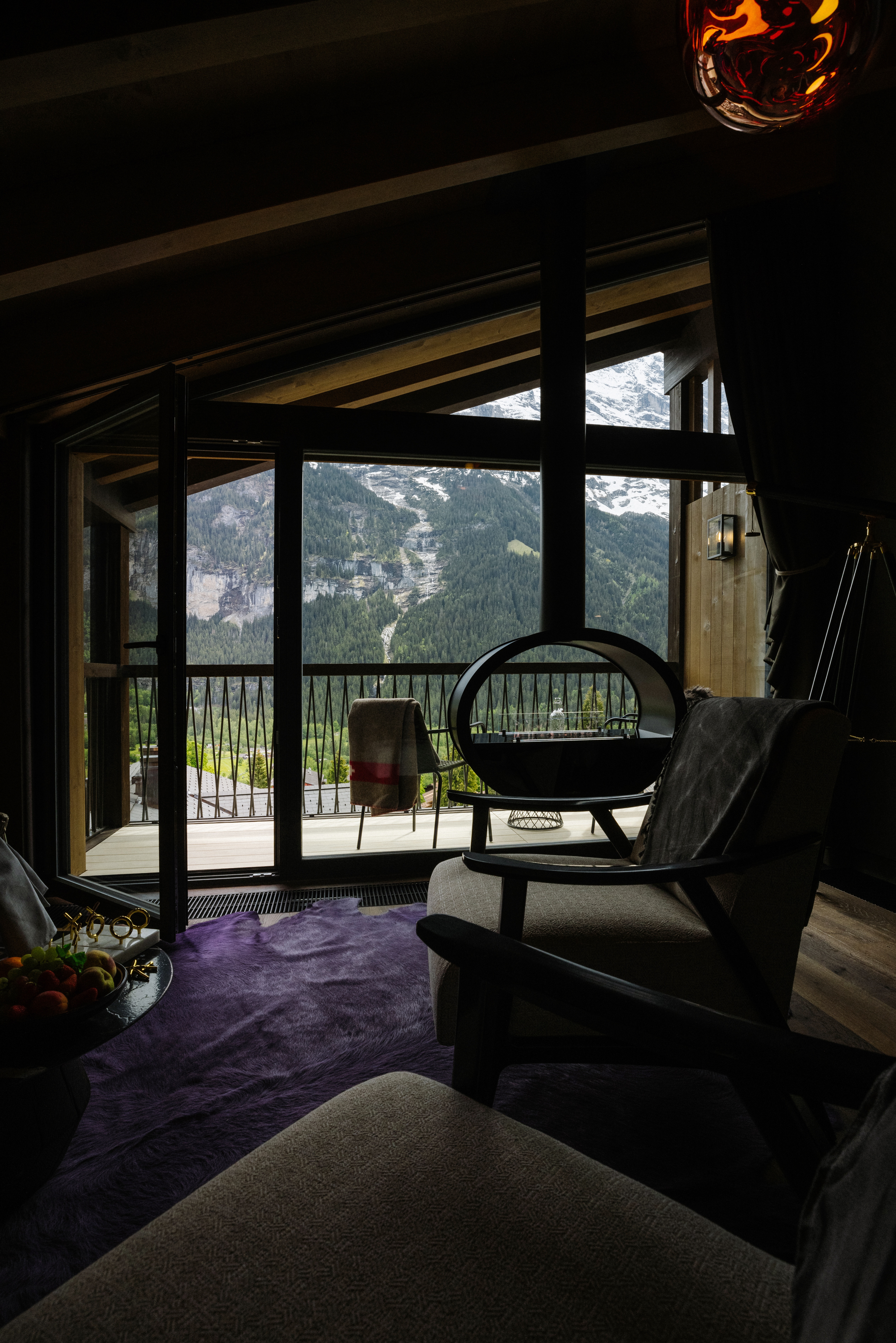 Guest room with large window toward mountains at Bergwelt Grindelwald, Grindelwald, Switzerland