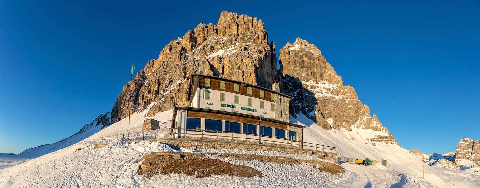 Rifugio Auronzo beneath the rocky Dolomite peaks, Tre Cime di Lavaredo, Italy