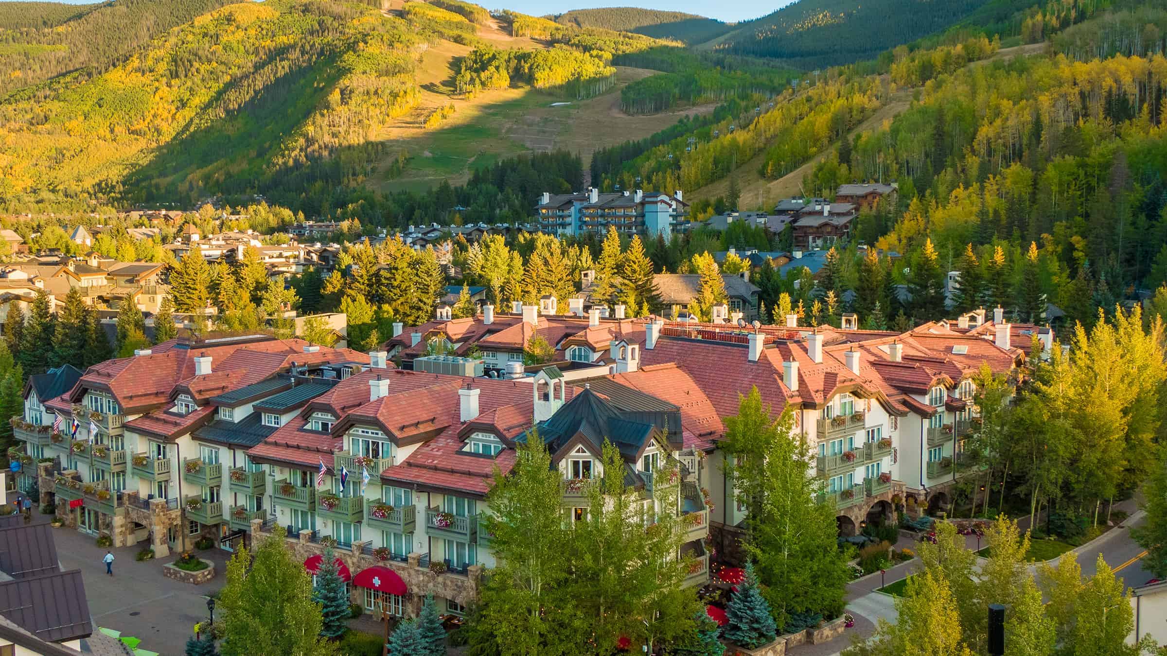 Elevated exterior view of Sonnenalp Vail among trees, Vail, USA
