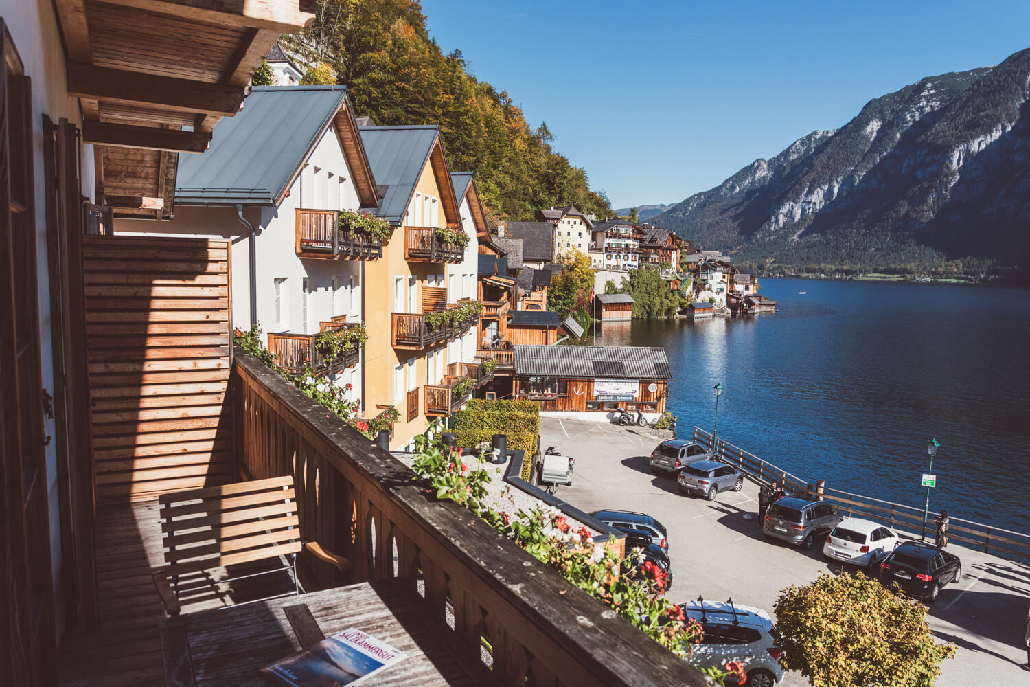 View from a Kainz house balcony across the hotel waterfront, Lake Hallstatt, and mountains