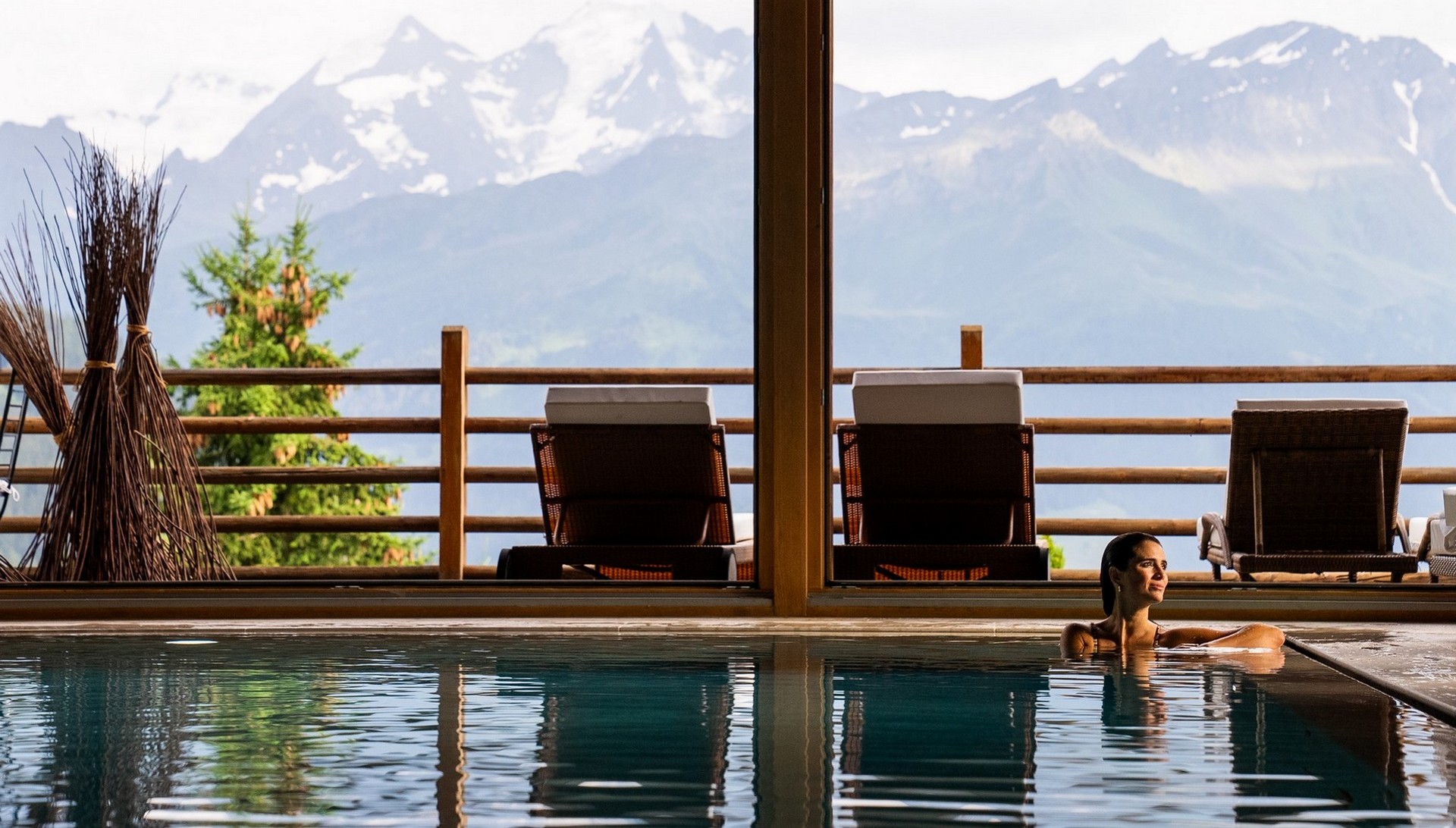 Indoor swimming pool with panoramic mountain windows, Chalet d'Adrien, Verbier, Switzerland