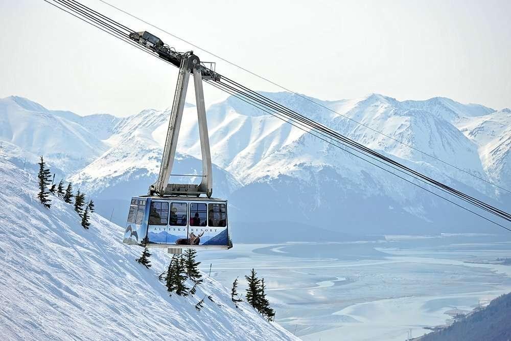 Aerial tram climbing above snowy mountain slopes, Alyeska Resort, Alaska, USA
