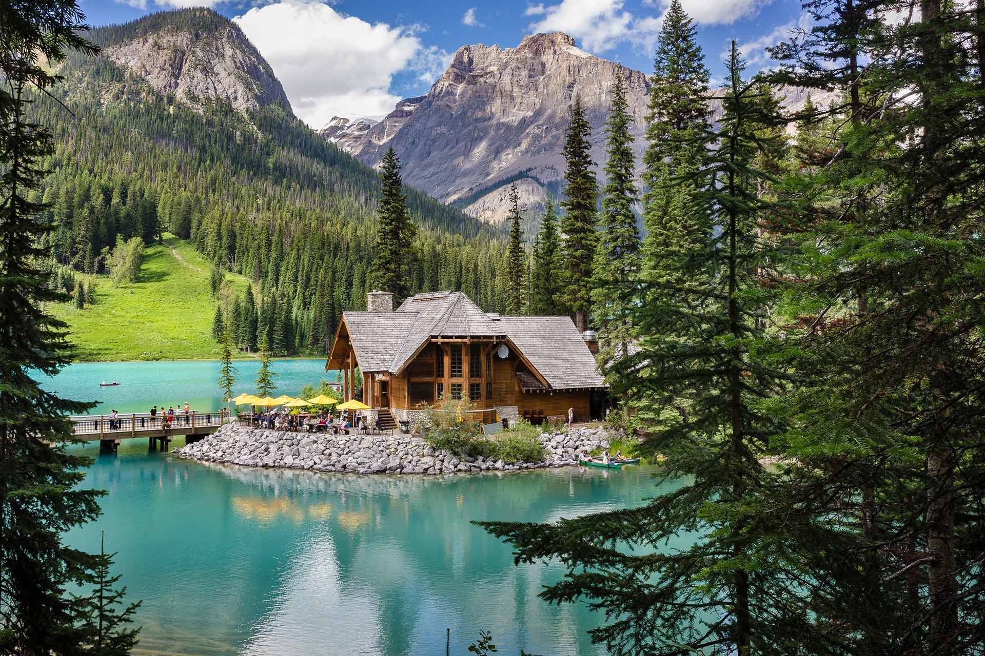 Lakeside timber building beside turquoise Emerald Lake and mountains, Yoho National Park, Canada