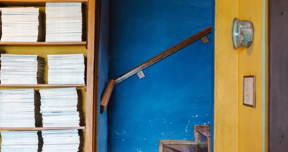 Blue stairwell with a wooden handrail, Casa Palopó, Lake Atitlán, Guatemala
