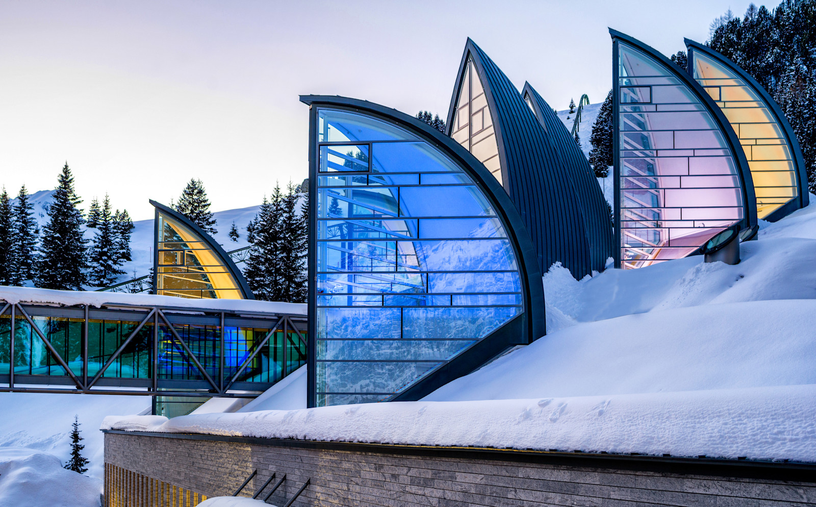 Snow-covered glass-sail structures of Tschuggen Bergoase, Arosa, Switzerland