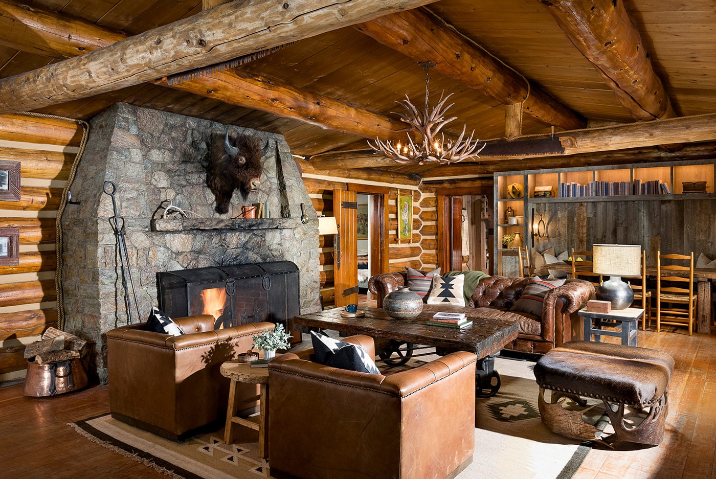 Log cabin lounge with stone fireplace, Lone Mountain Ranch, Big Sky, USA