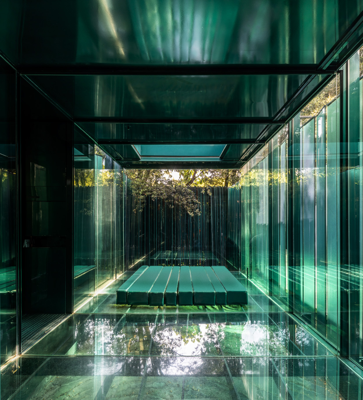 Close view of rushing water among dark rocks at Les Cols Pavellons, Olot, Spain