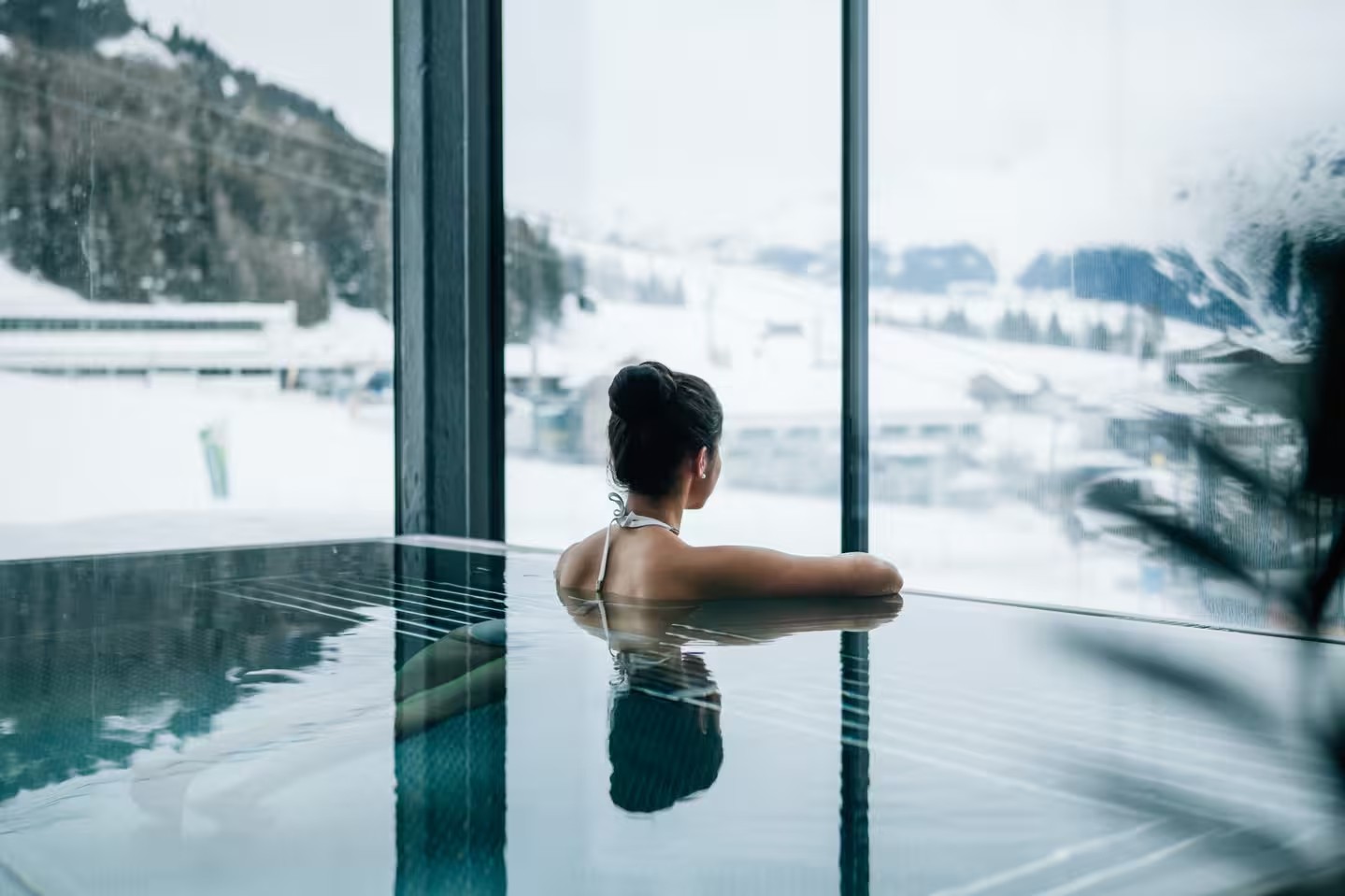 Pool overlooking the winter landscape at Schlosshotel Fiss, Tyrol, Austria