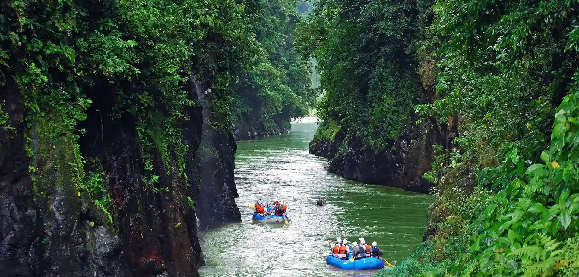 Whitewater rafting between steep rainforest-covered canyon walls, Pacuare Lodge, Pacuare River, Costa Rica