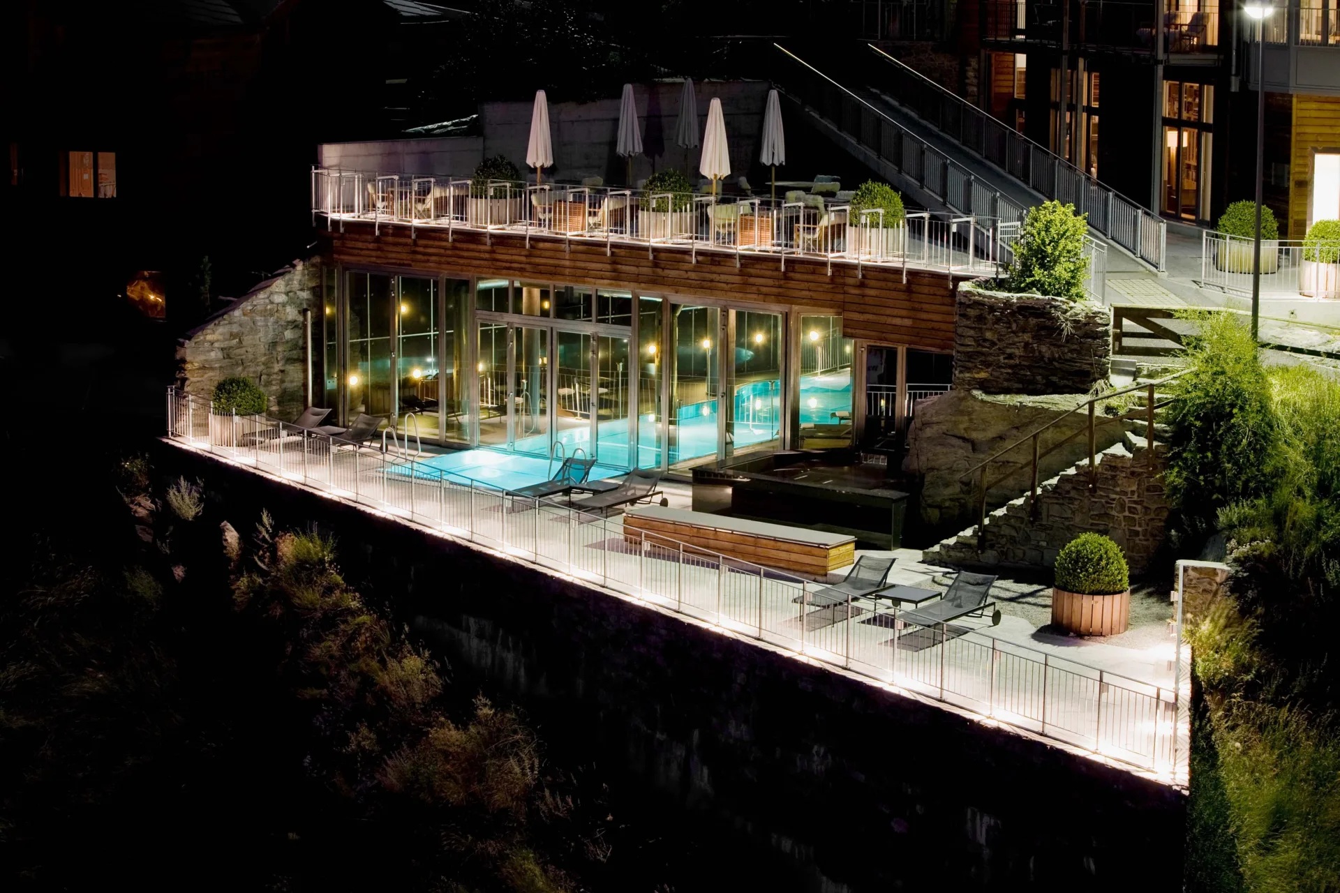 Illuminated pool terrace at night at The Omnia, Zermatt, Switzerland