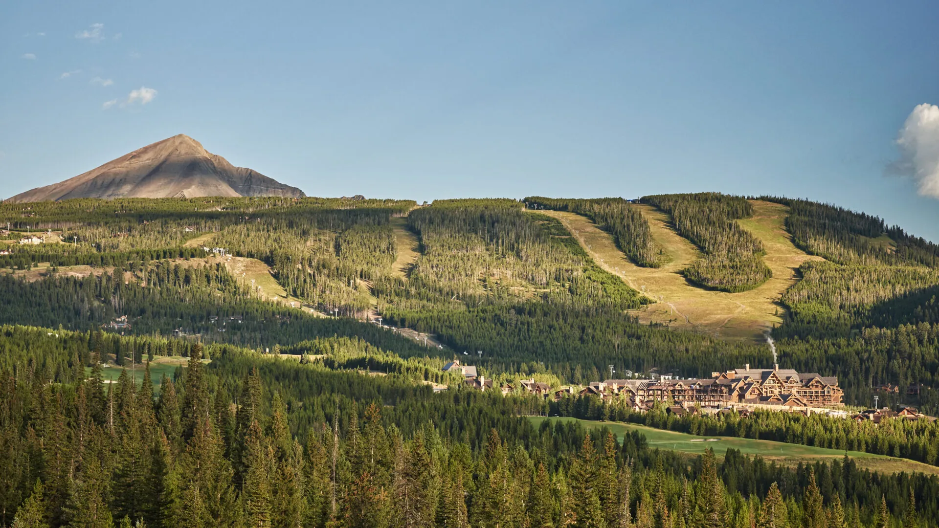 Resort exterior in its mountain setting at Montage Big Sky, Big Sky, USA