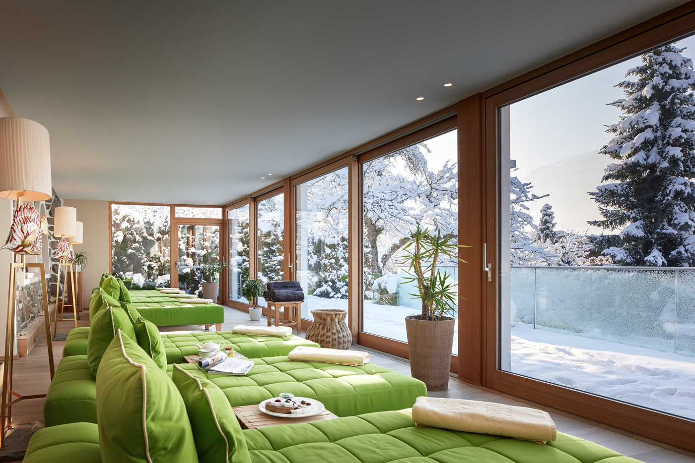 Spa relaxation lounge overlooking snow, Tennerhof, Kitzbühel, Austria
